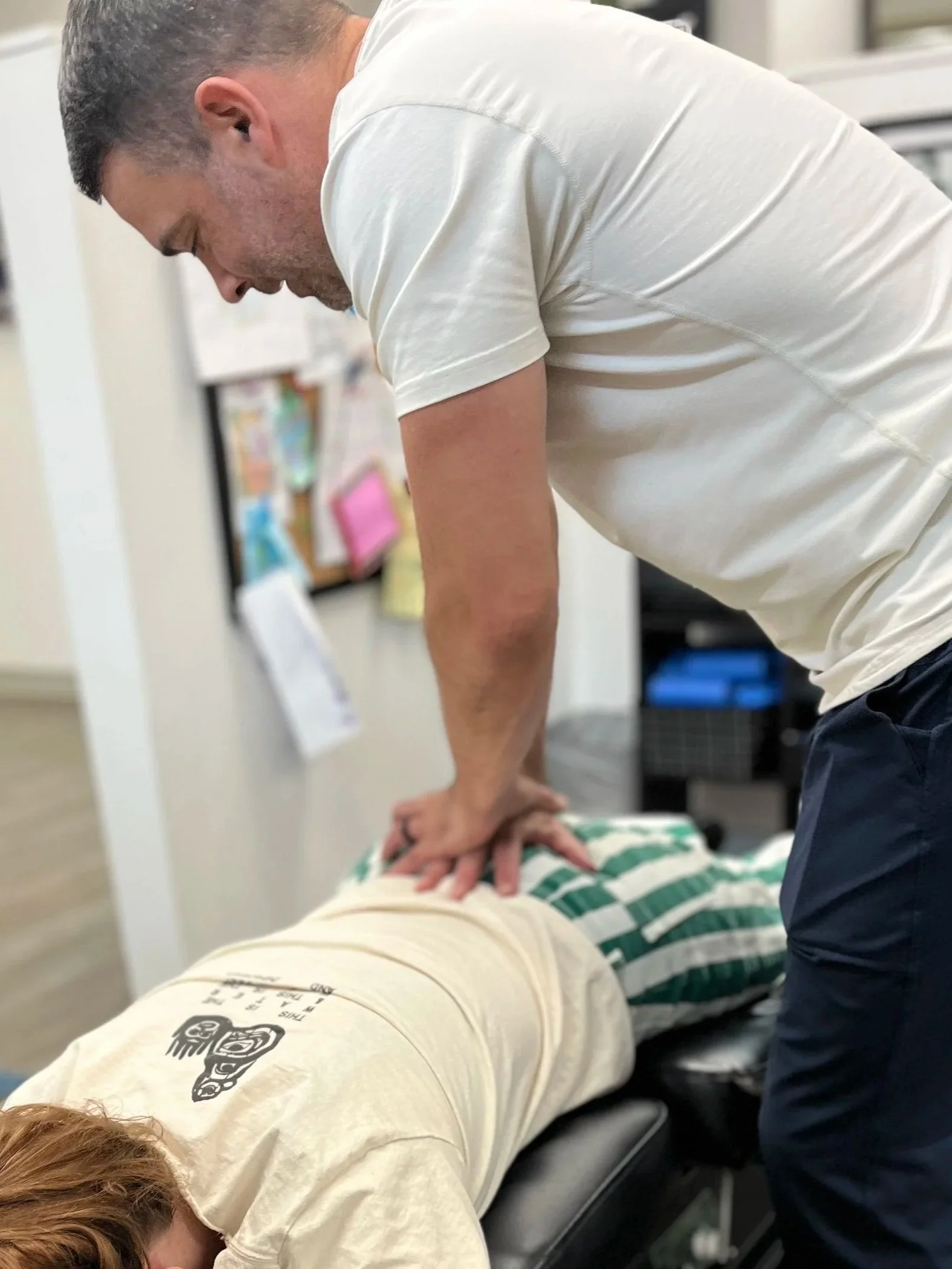 Dr. Tyler performing a targeted SI joint adjustment at Form Chiropractic KC in Kansas City, MO