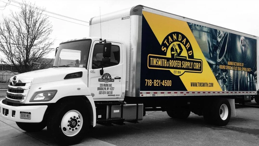 STANDARD TINSMITH UNIQUE INTERESTING TRUCK WRAP.jpg