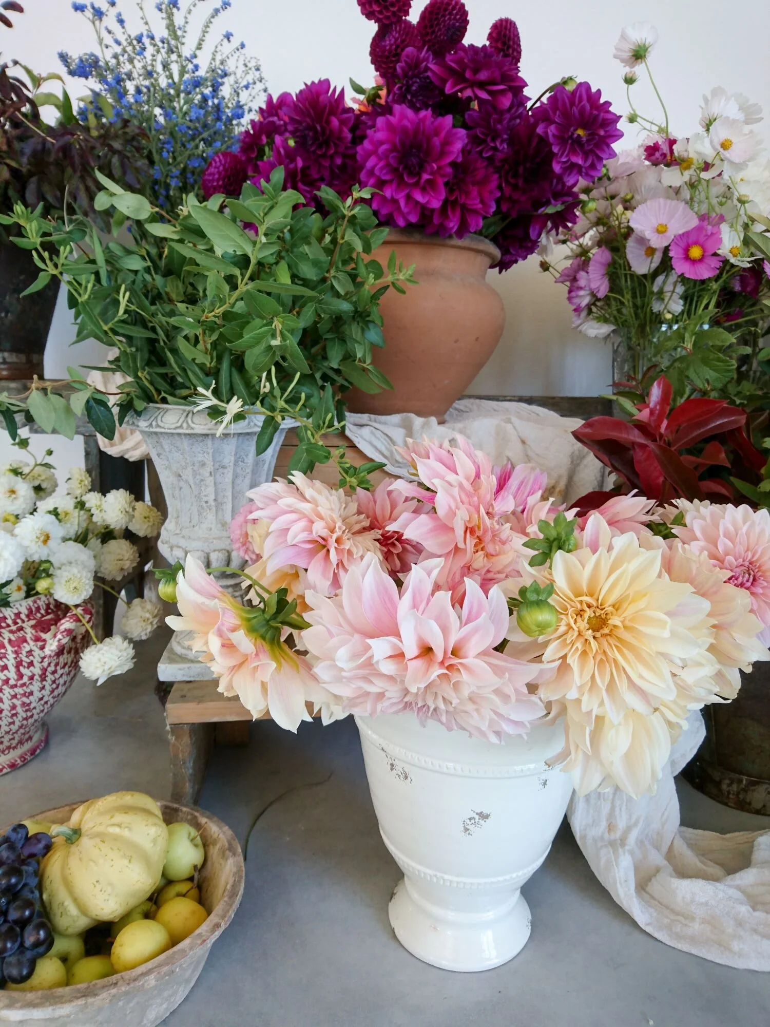 Floral display of cafe au lait dahlias and other flowers.