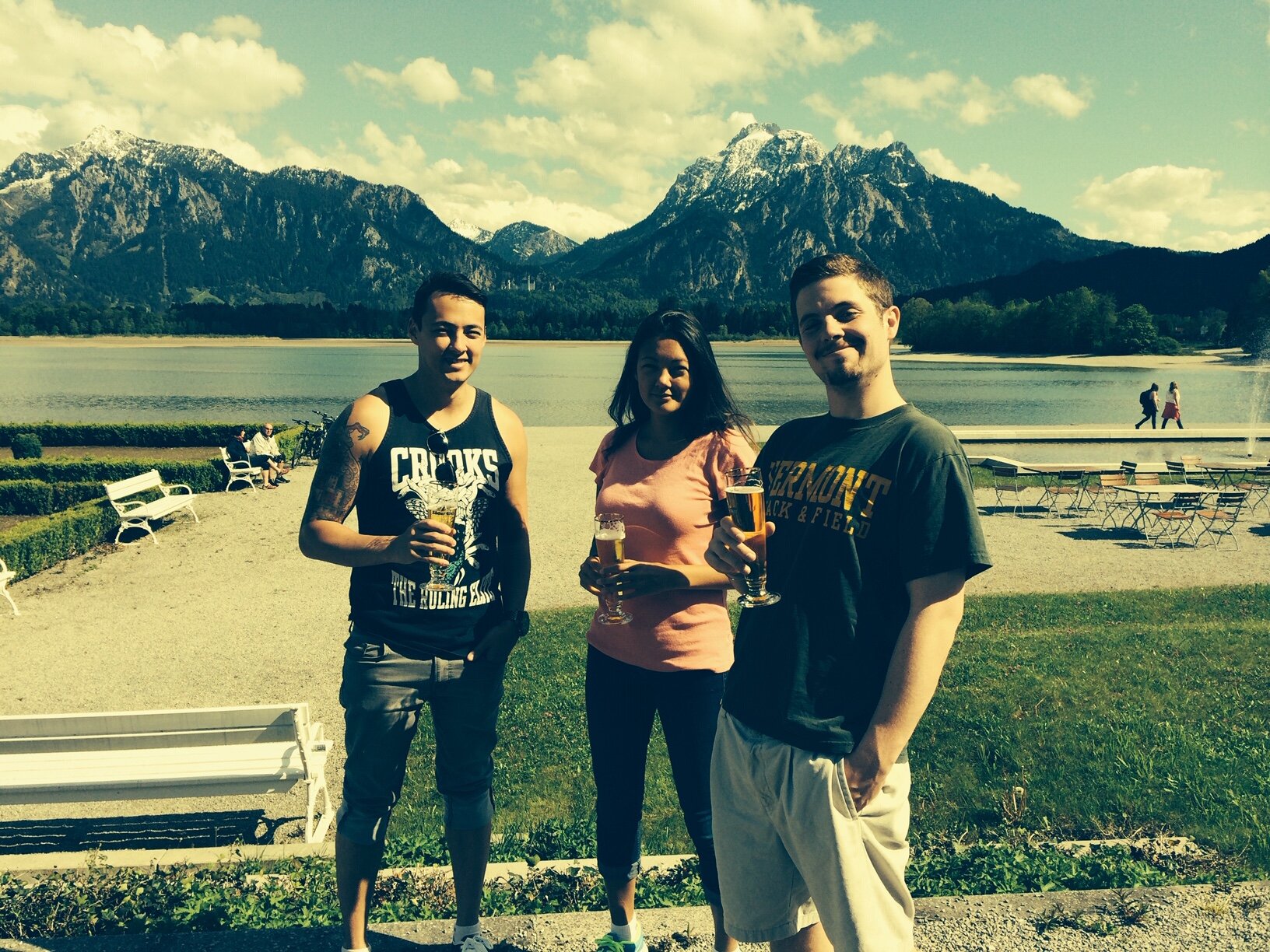 Our kids enjoying a well earned beer during a bike ride in Fussen Germany. Mad Ludwig’s castle in distance