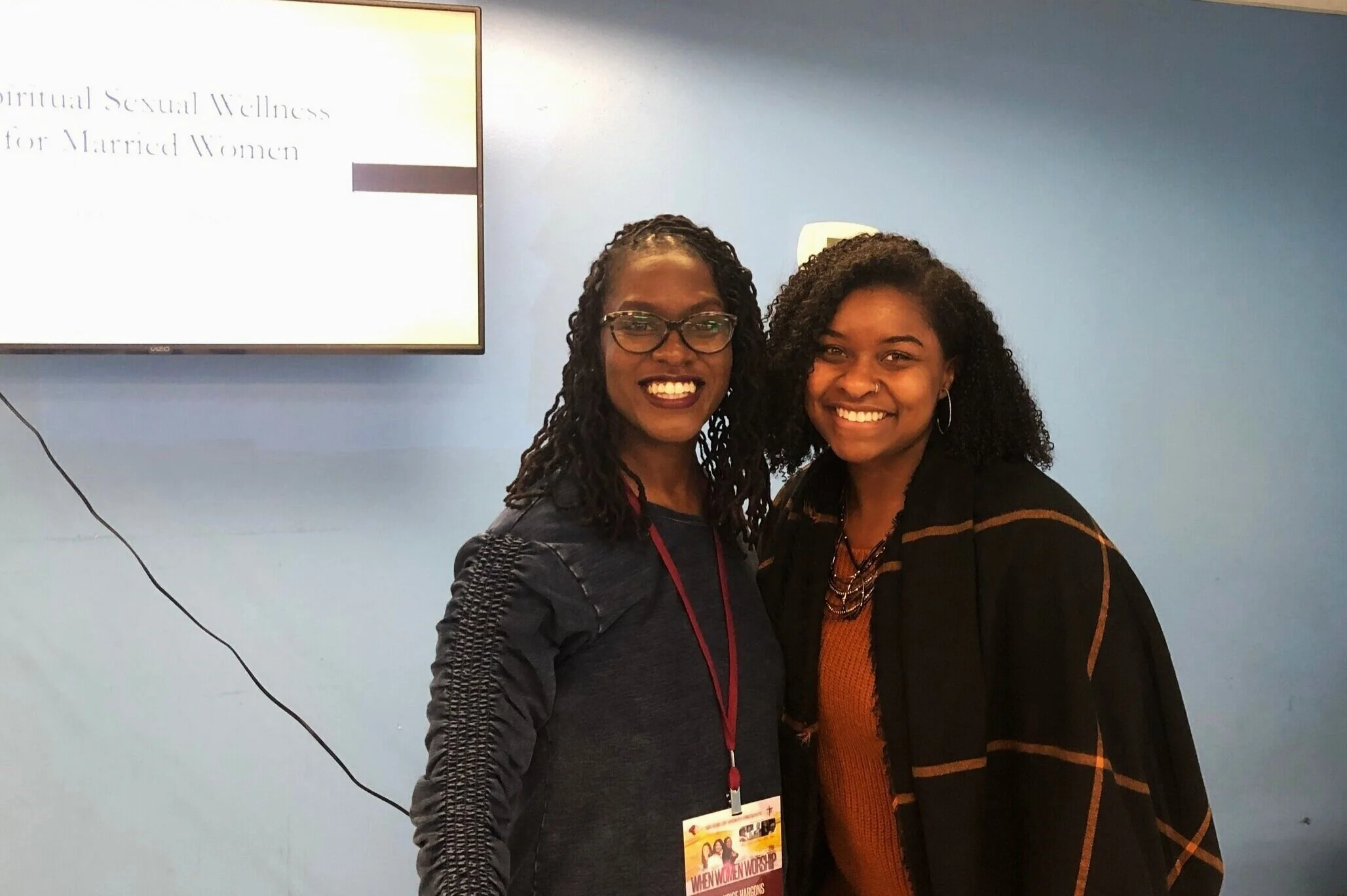 Presenting on Black women’s sexual pleasure at church with my supervisor, Dr. Candice Hargons