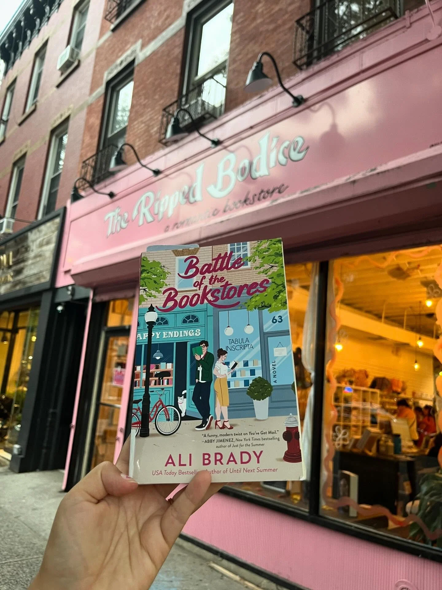 Ali Brady&rsquo;s &ldquo;Battle of the Bookstores&rdquo; is a pretty sweet, narrative changing retelling of &ldquo;You&rsquo;ve Got Mail&rdquo; with the twist that Tom Hanks is represented by two characters: the actual villain character and the enemy