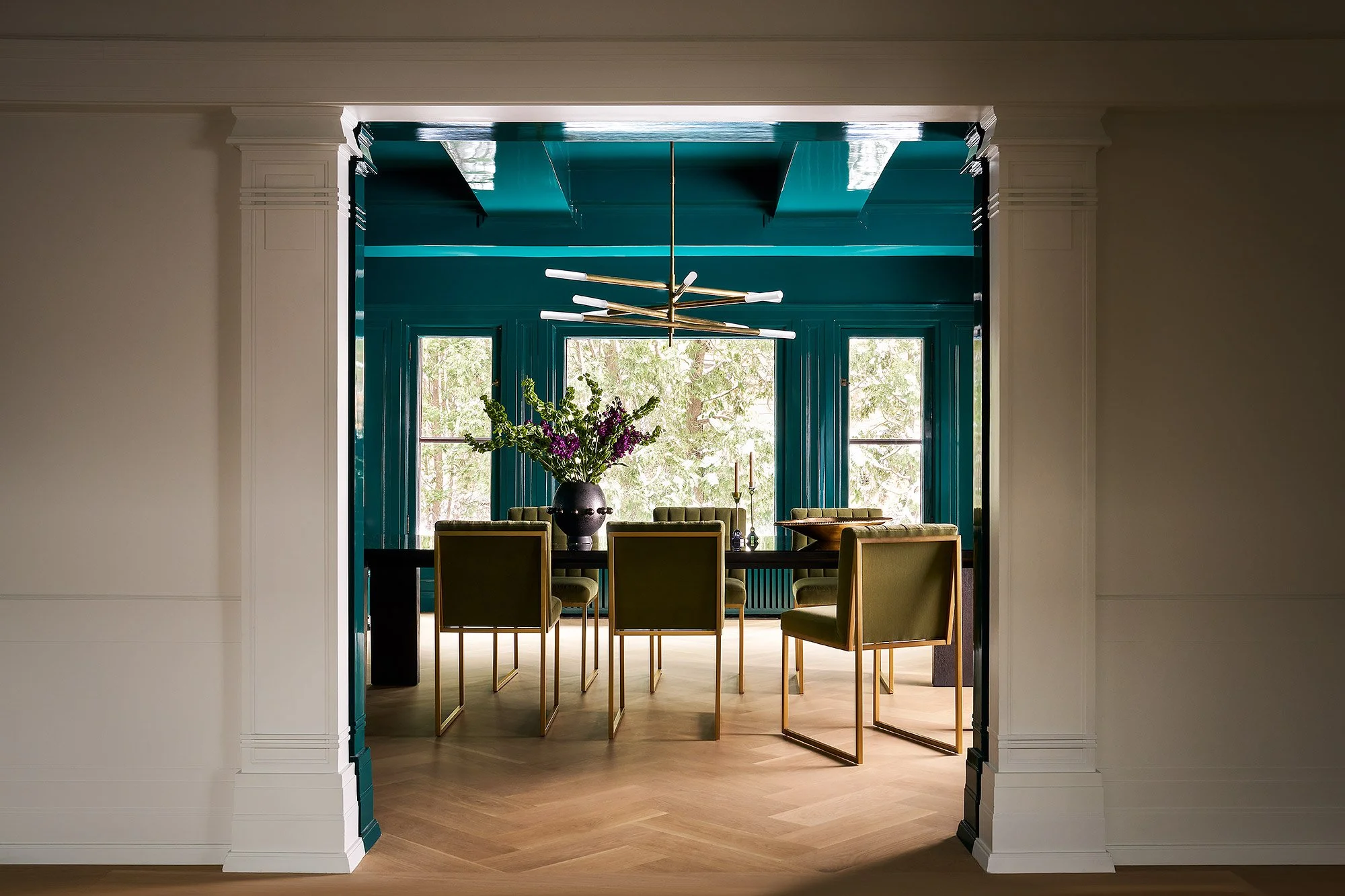 Custom lacquered dining room with high-gloss  finishes and luxury design, front view.