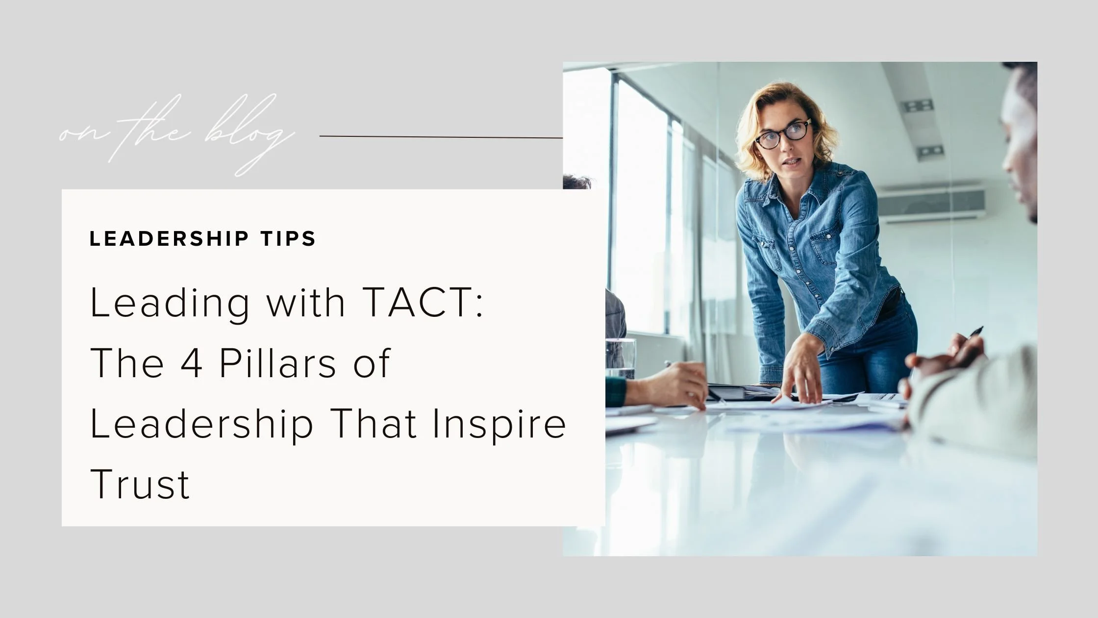 A female leader in a denim shirt leans over a conference table engaging with her team, illustrating the four pillars of leadership—Transparency, Awareness, Curiosity, and Trust—from the TACT leadership framework