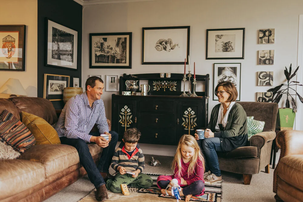 The black and white wall of art in the living room is Jeanie’s favourite part of her home’s interior. The black arts and crafts dresser was painted by Jeanie. “No one wanted to buy it, so I decided we would just have to keep it,” she says.