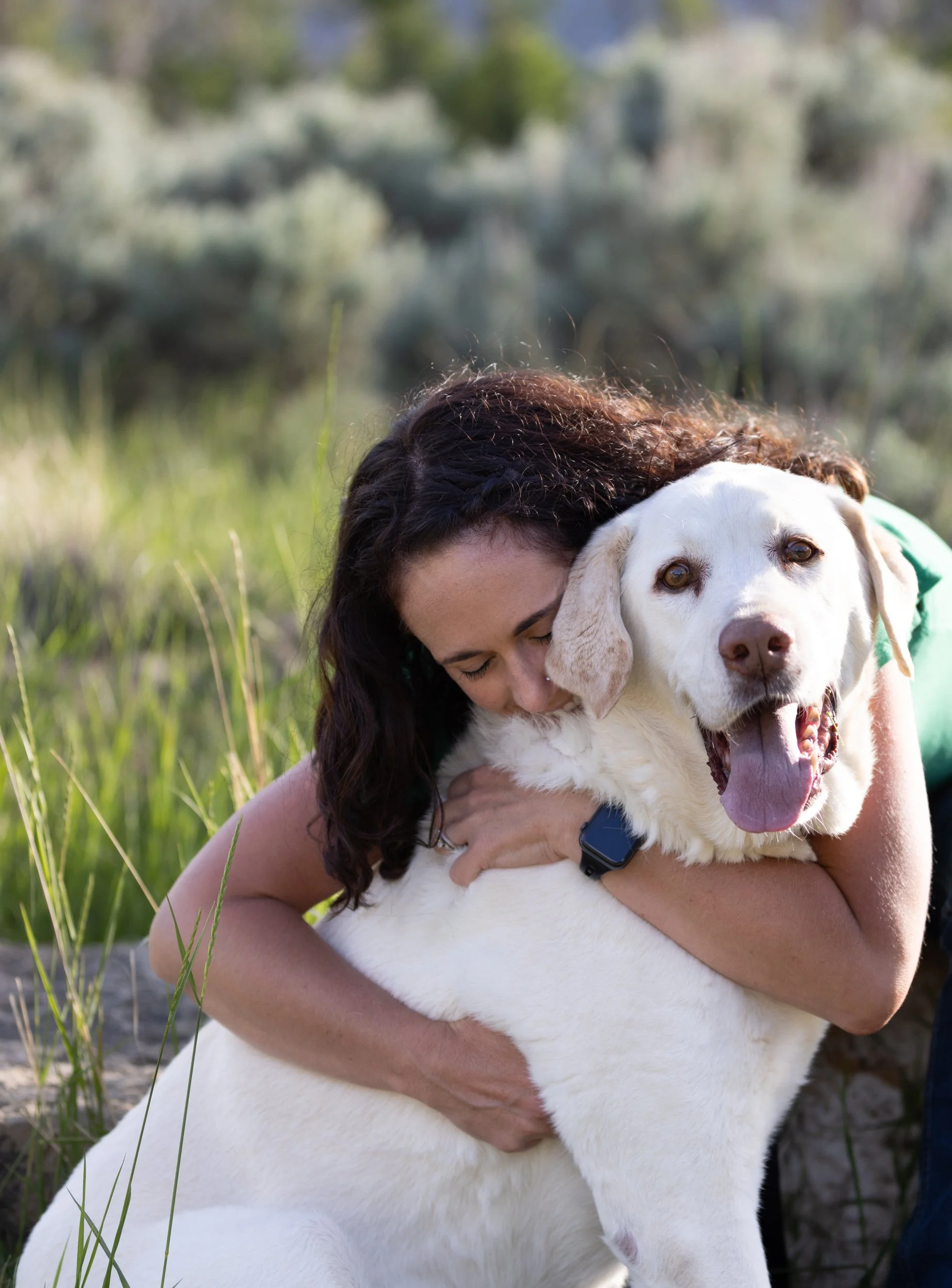 white_lab_dog_owner_hug.jpg