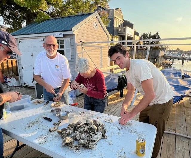 Oyster shucking at the raw table.  Photo by Kathy Hauty.  