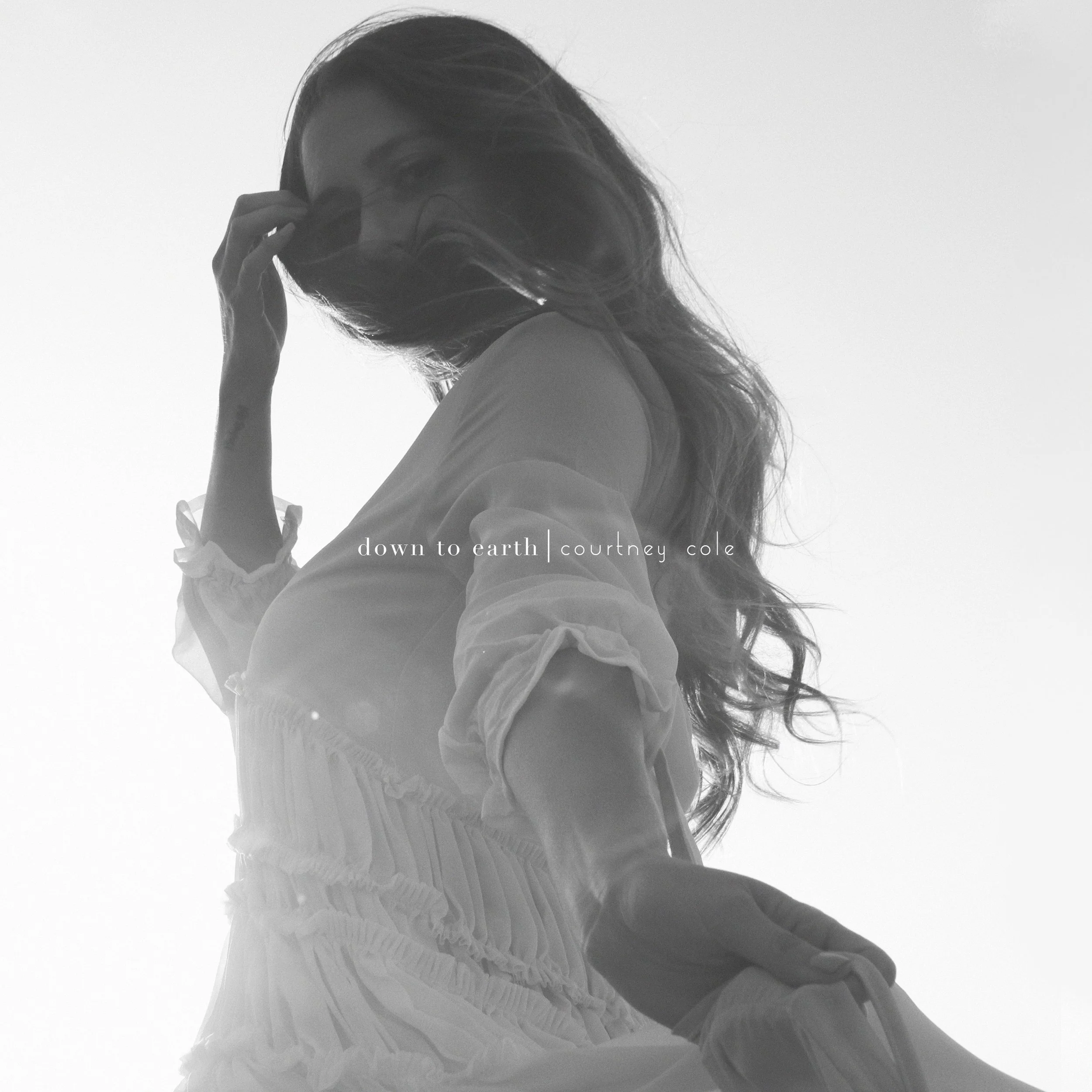 Courtney Cole showcases her vocals on striking single, "down to earth"