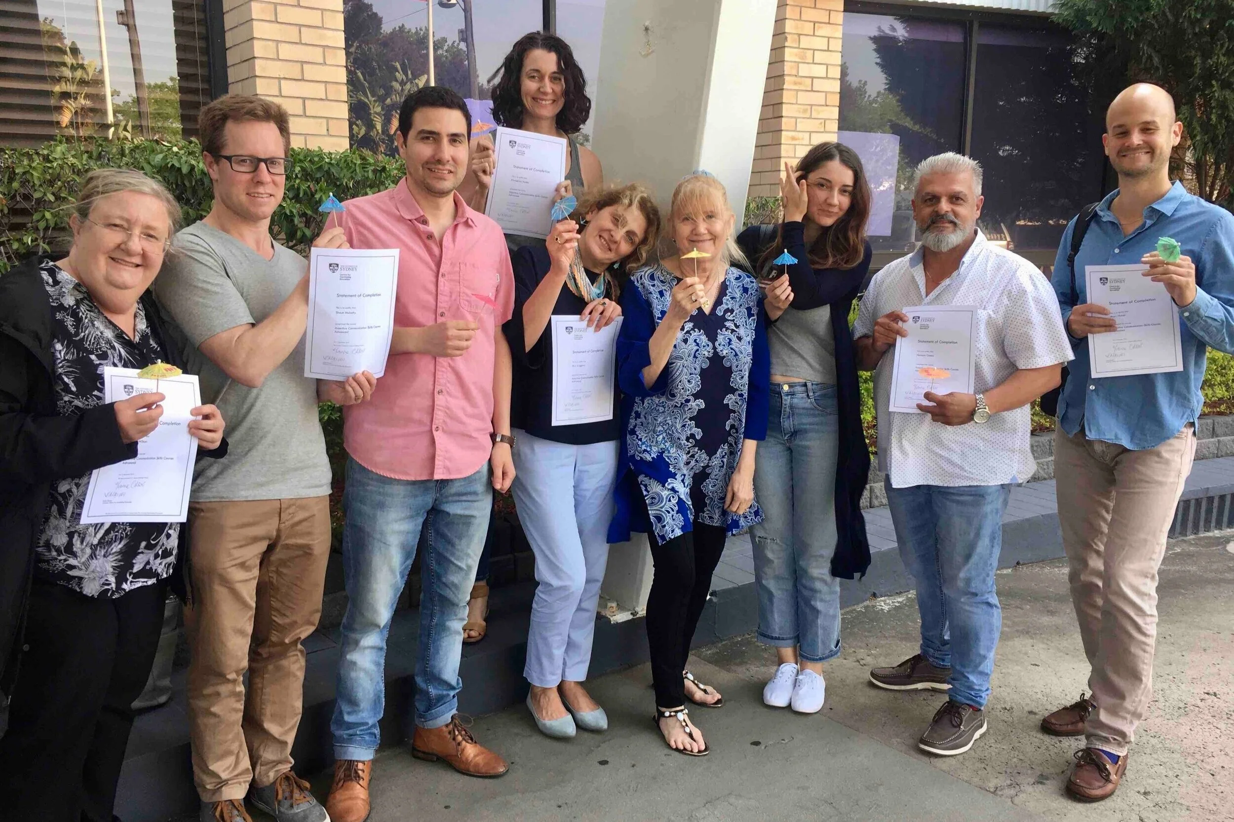 Advanced Grads with Certificates and ‘Umbrellas of Respect’