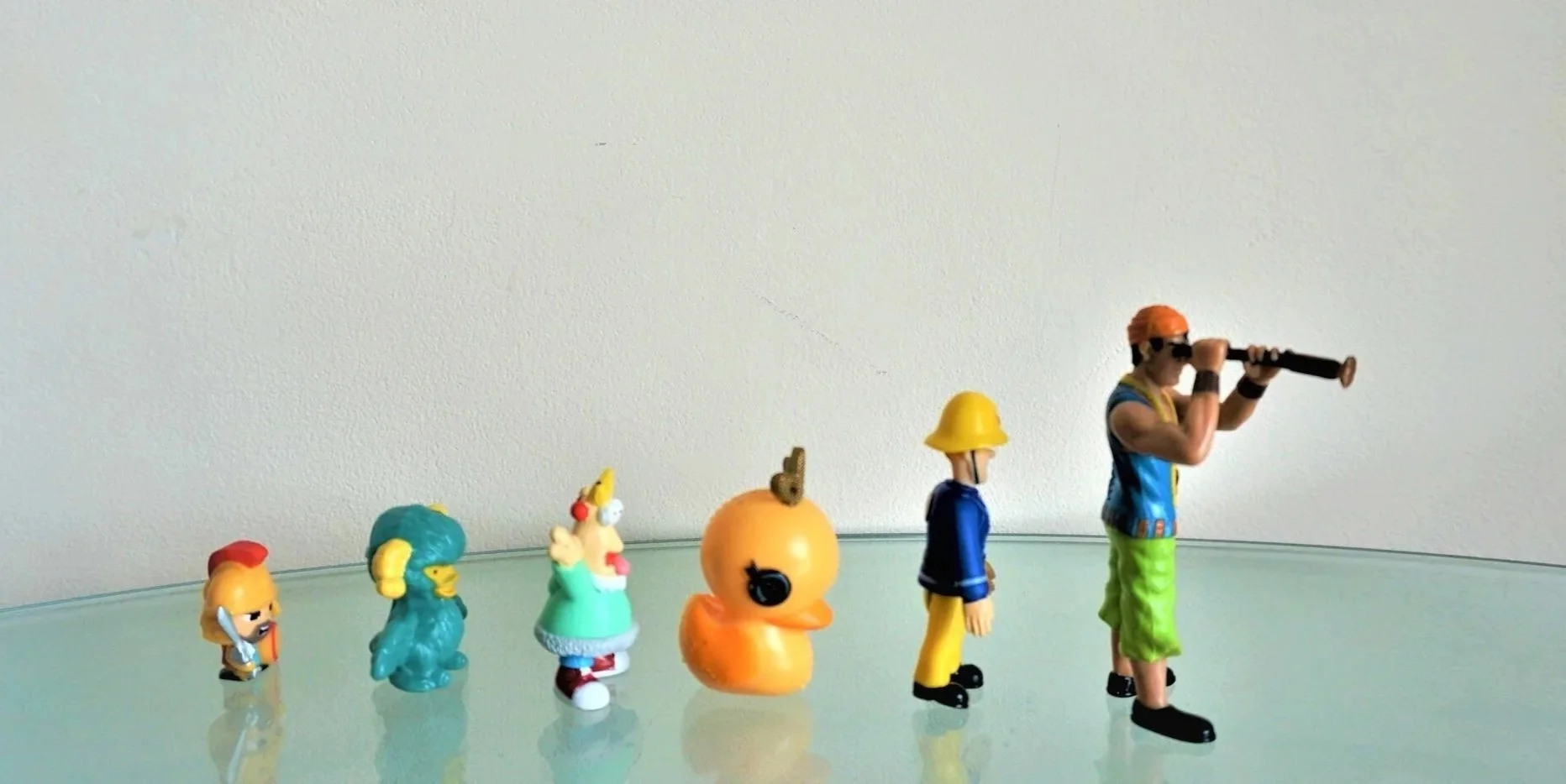 Symbolic objects standing in a line of increasing height.