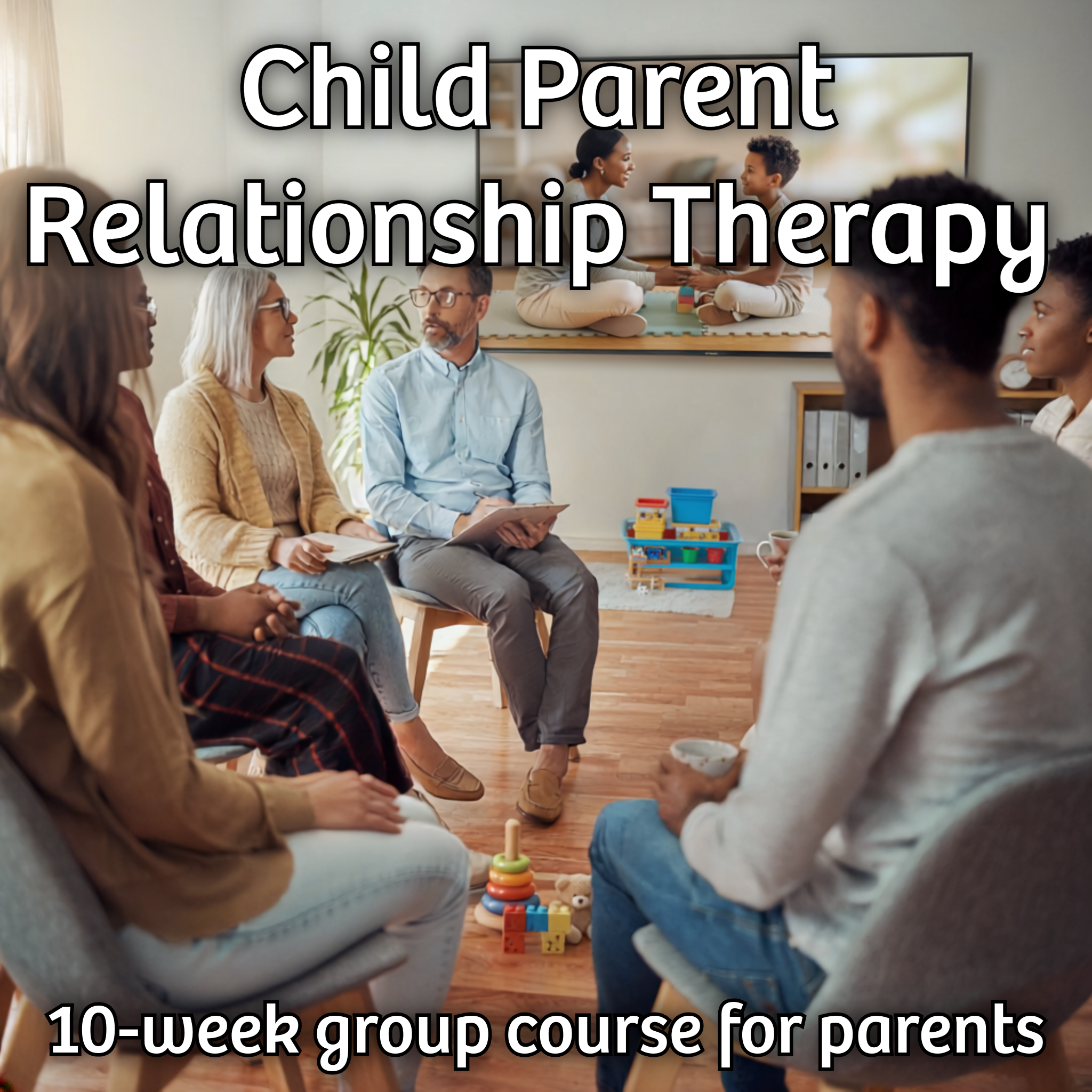 Group of adults sat in chairs in a circle talking.  Toys on the floor.  A presentation screen shows a video of a mother and child playing together on a mat.