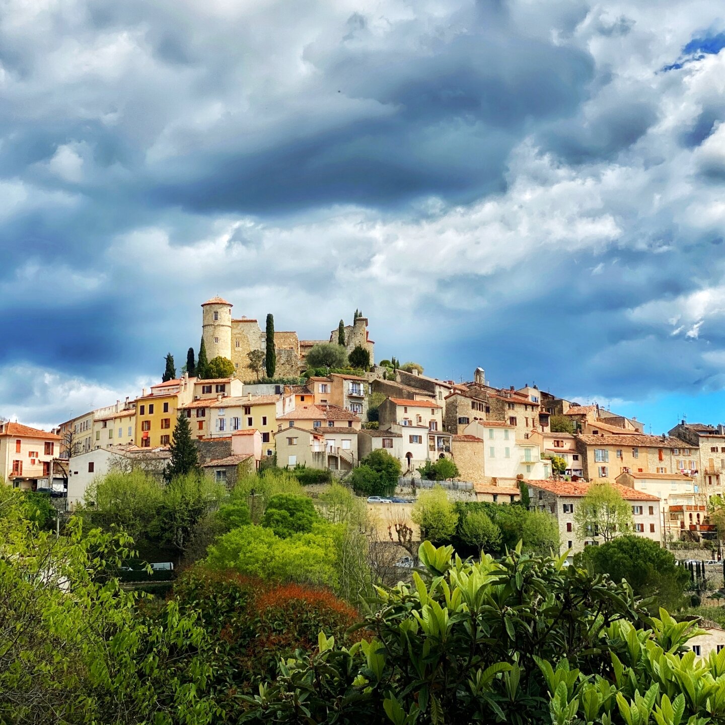 The perched hill village of Callian which dates to the 12th century. April weather is very dramatic here, sun and showers, dramatic clouds and sudden spotlights of sun. #provencealpescotedazur  #hillvillage #mediaval #heavenonearth