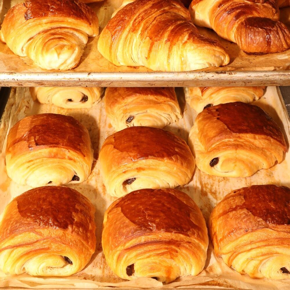 Croissants and pains au chocolat from the best bakery around - the Boulangerie de Mons. Straight out of the oven they are so scrumptious.https://catherinekarnowphotoworkshops.com/france-book #freshcroissants #pastries #heaven #frenchpastries #painauc