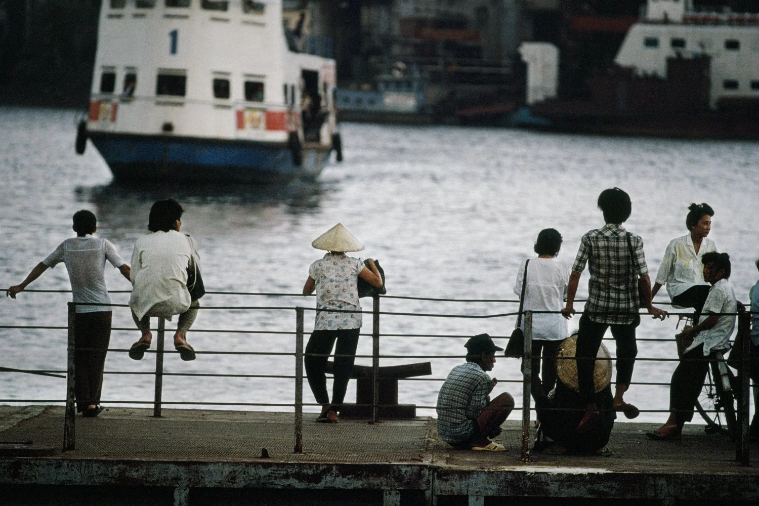 PEOPLE WAIT FOR THE FERRY, HO CHI MINH CITY, 1990