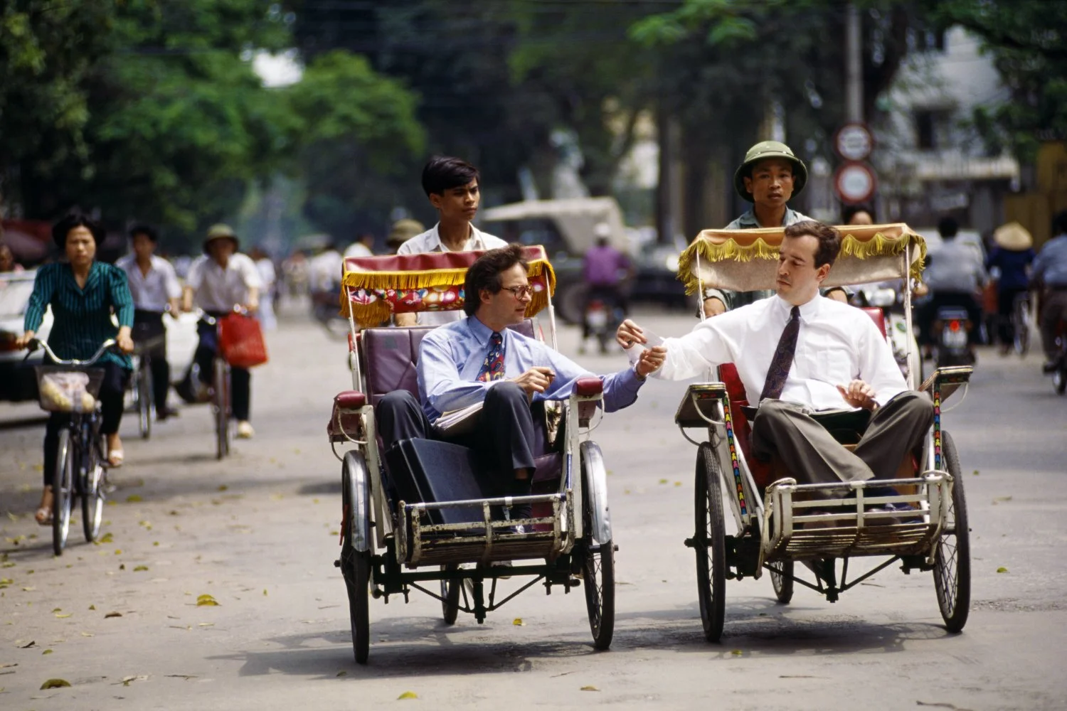 BUSINESSMEN IN CYCLOS, 1995