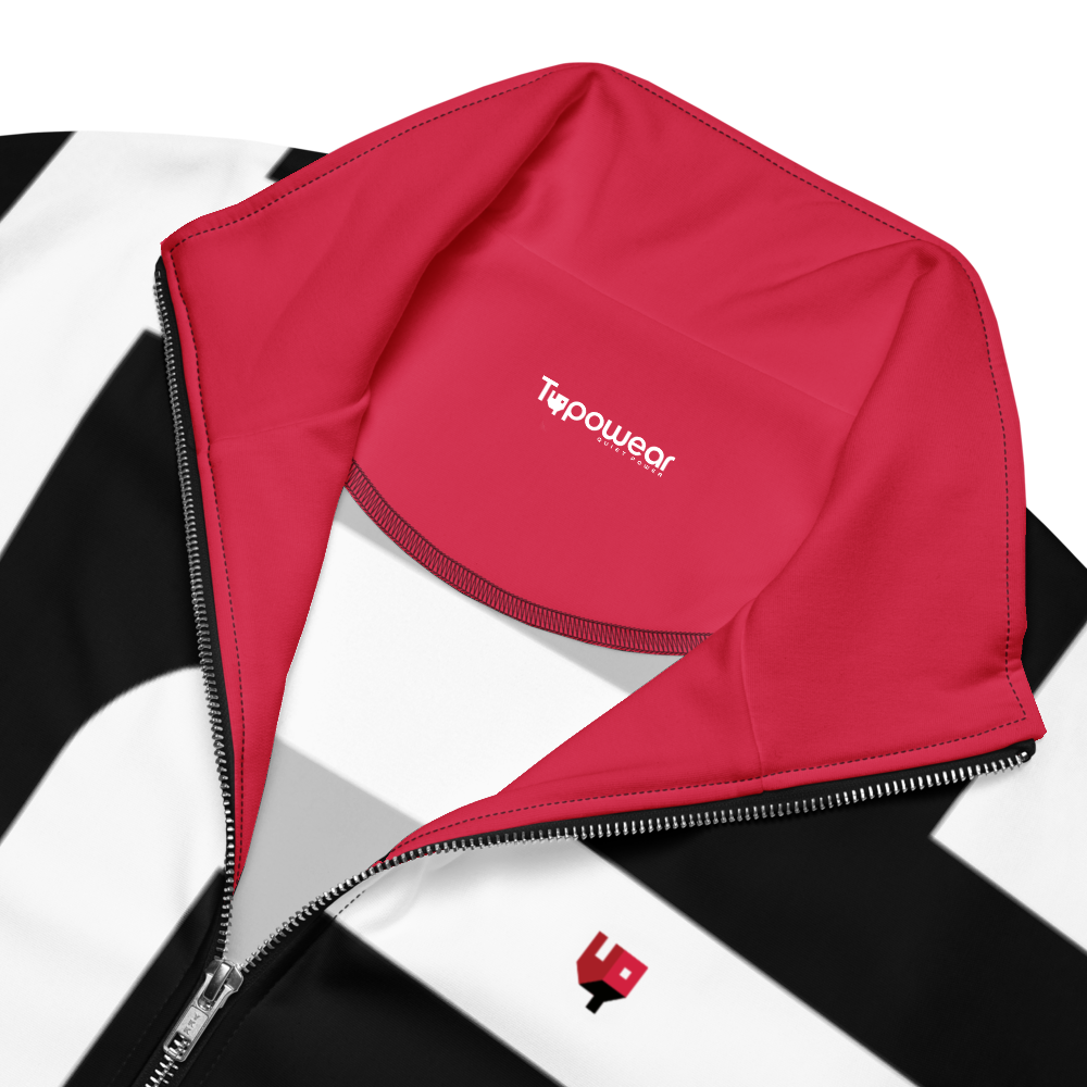 Close-up of red interior lining and zipper detail inside track jacket – signature contrast.
