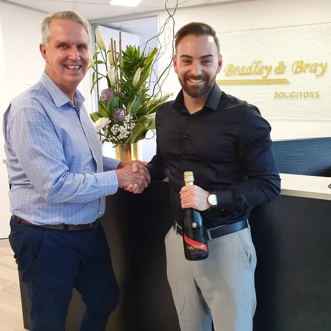 Co-Directors Mark Bray and Jacob Corbett celebrate Settlement