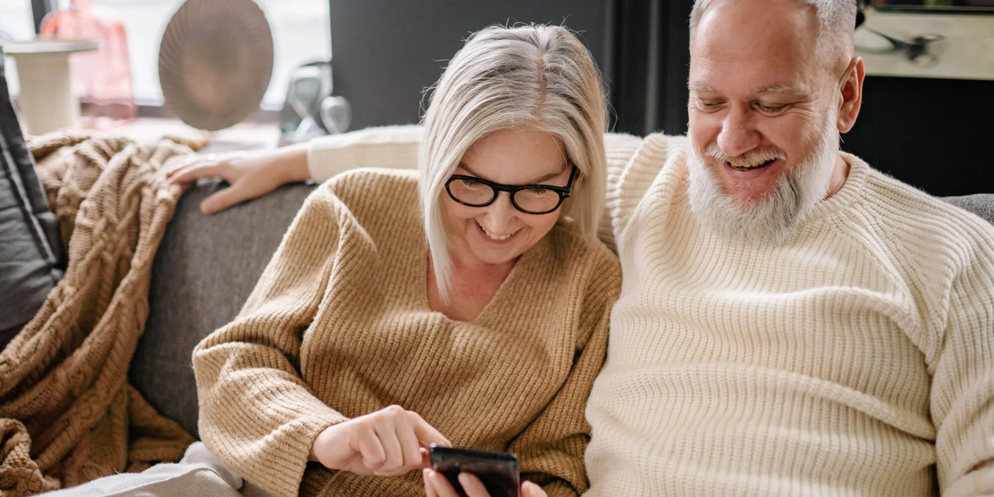 A couple talking to their family living overseas online