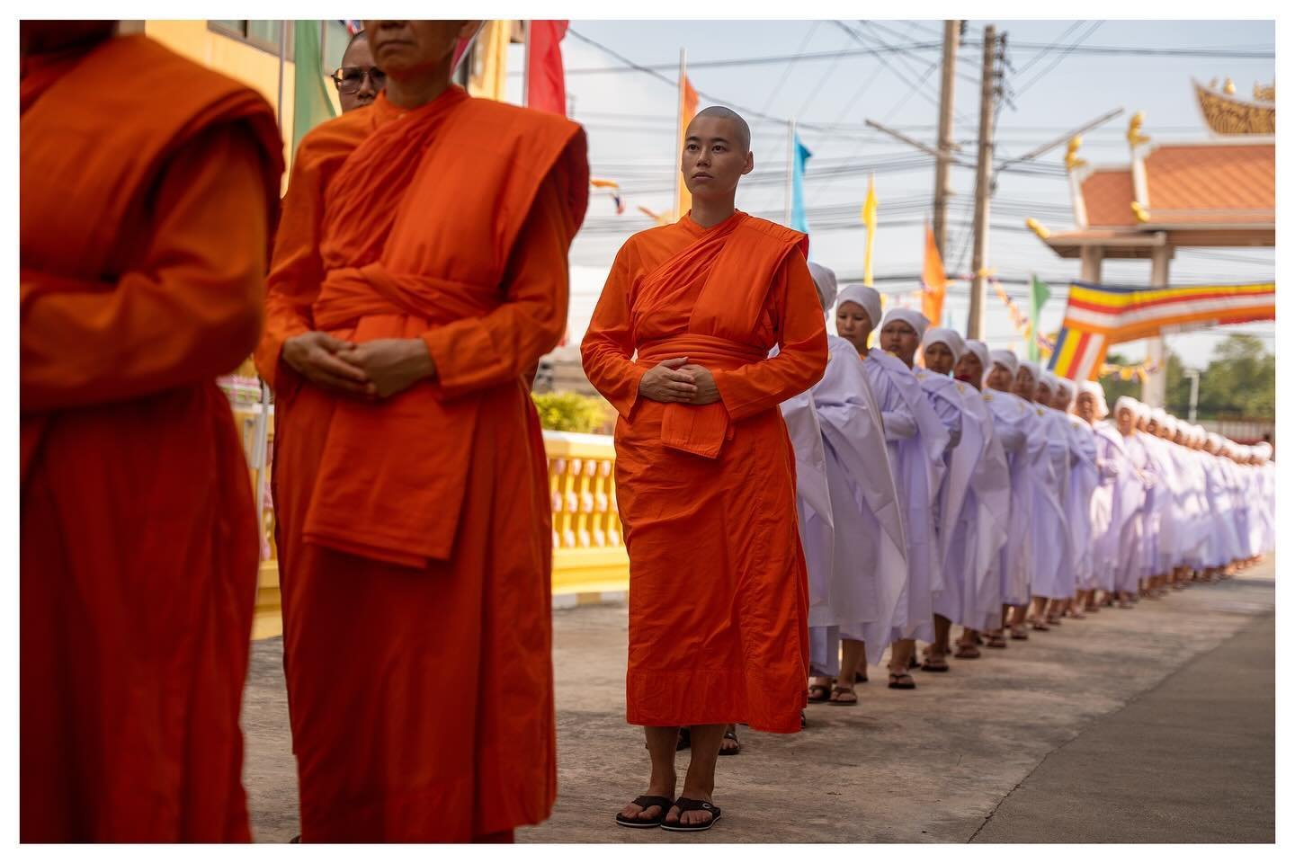 At Songdhammakalyani Monastery, an hour outside Bangkok, 31 women sit in the garden. Dressed in white robes, their hands are folded and sweat is running down their face. It is only eight in the morning but the heat is already oppressive. Family membe