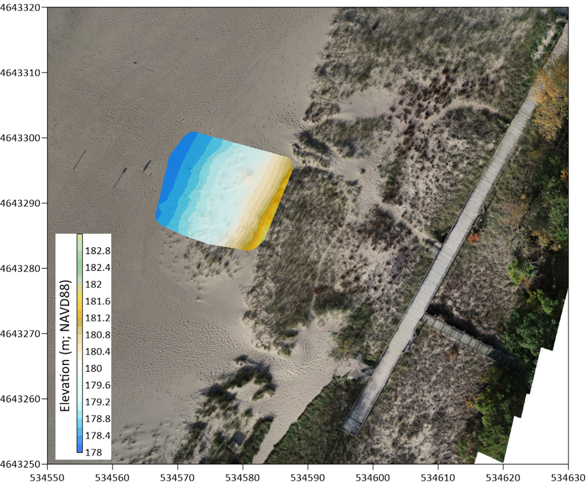 Birds eye view of a beach and boardwalk with a topographic map overlay showing the topography of the beach and dunes.