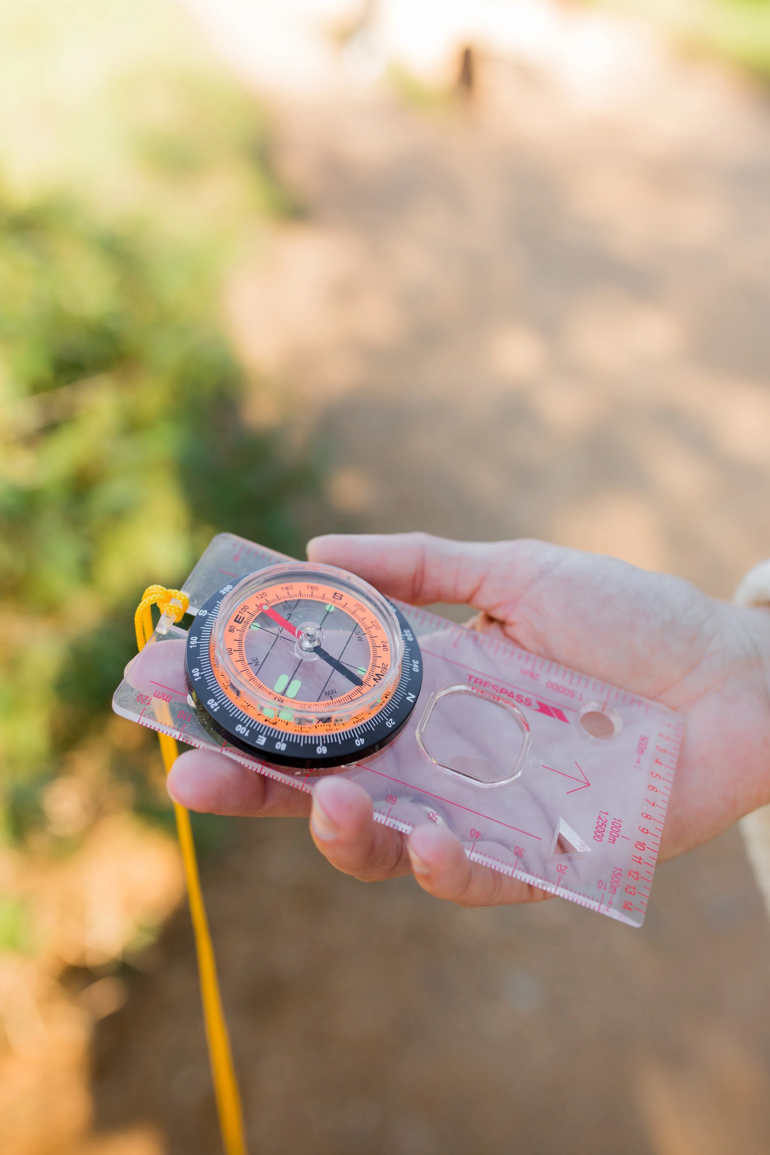 hand holding a compass as a metaphor to finding your ideal client