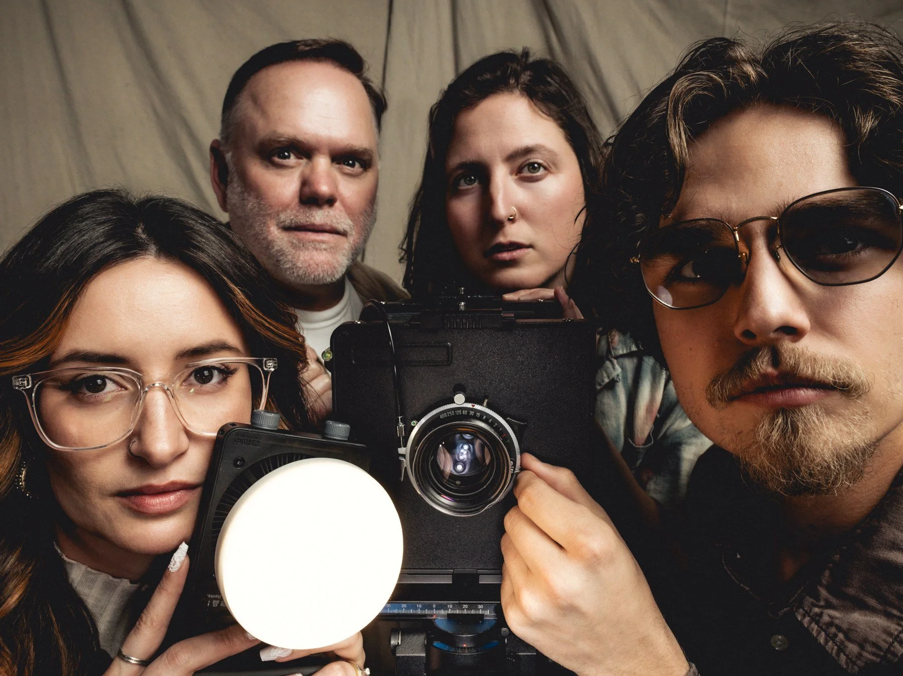 Creative team with large format camera and studio light at Lightbox OKC photo studio in Oklahoma City