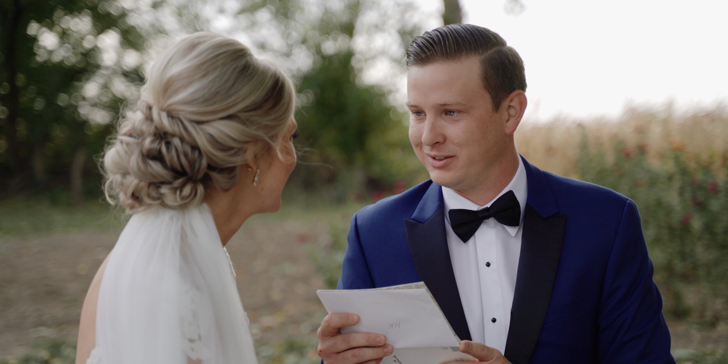 Groom reads letter to bride on wedding day.