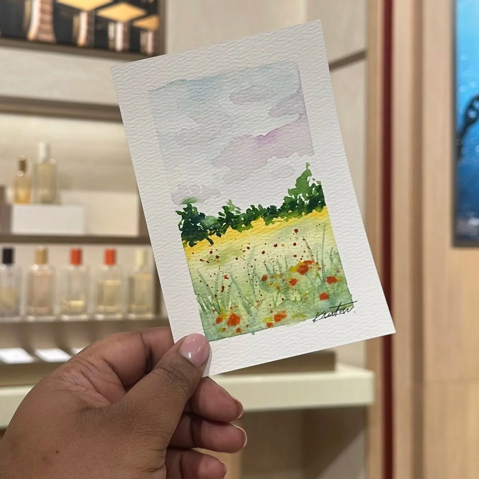 Expressive watercolor landscape with fluid brushwork and layered colors, evoking a serene outdoor setting – Didi Letters