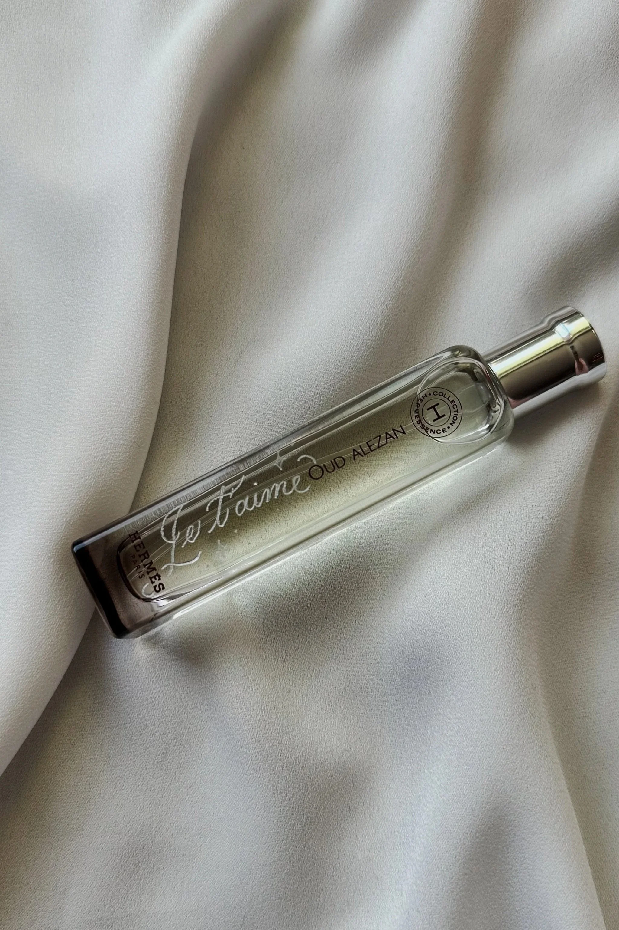 Hand engraving on a Hermès perfume bottle, showcasing personalized lettering for a luxury gift or event - Didi Letters