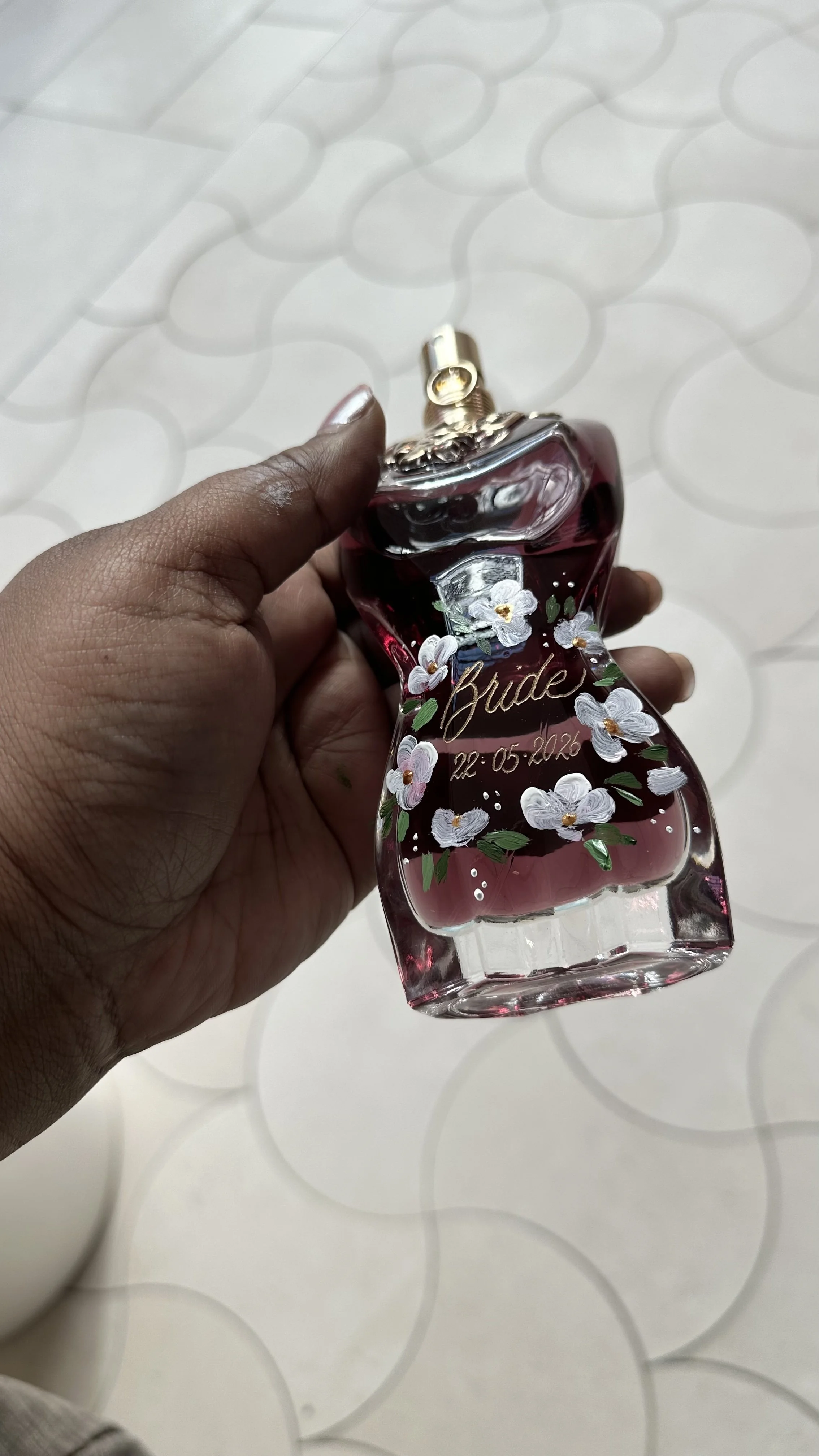 Hand-painted floral design & perfume engraving on a Jean Paul Gaultier perfume bottle for a bride, creating a personalized and elegant wedding keepsake - Didi Letters