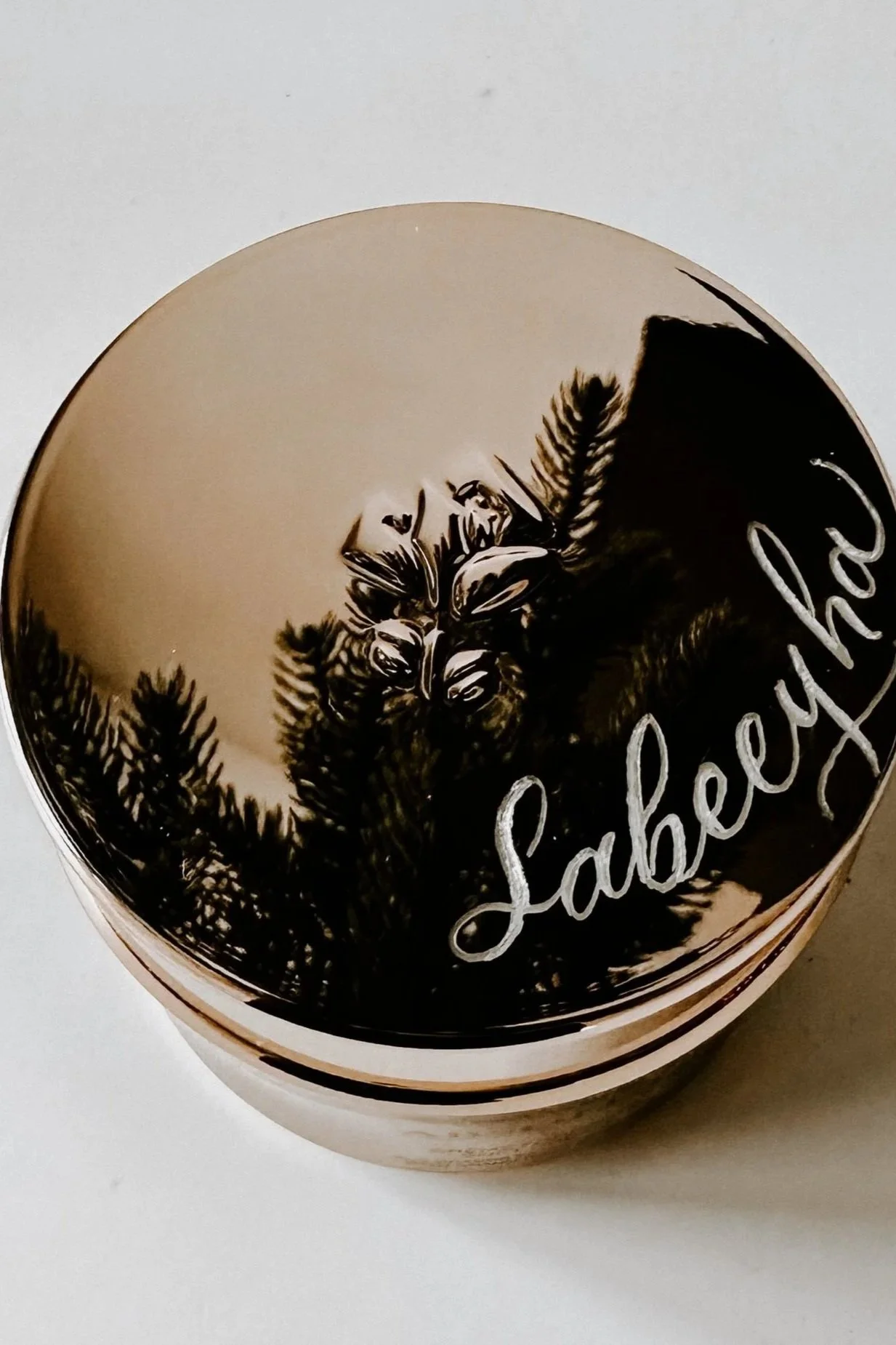 Custom engraving on a Lancôme face cream jar, featuring personalized lettering for a luxury skincare gift