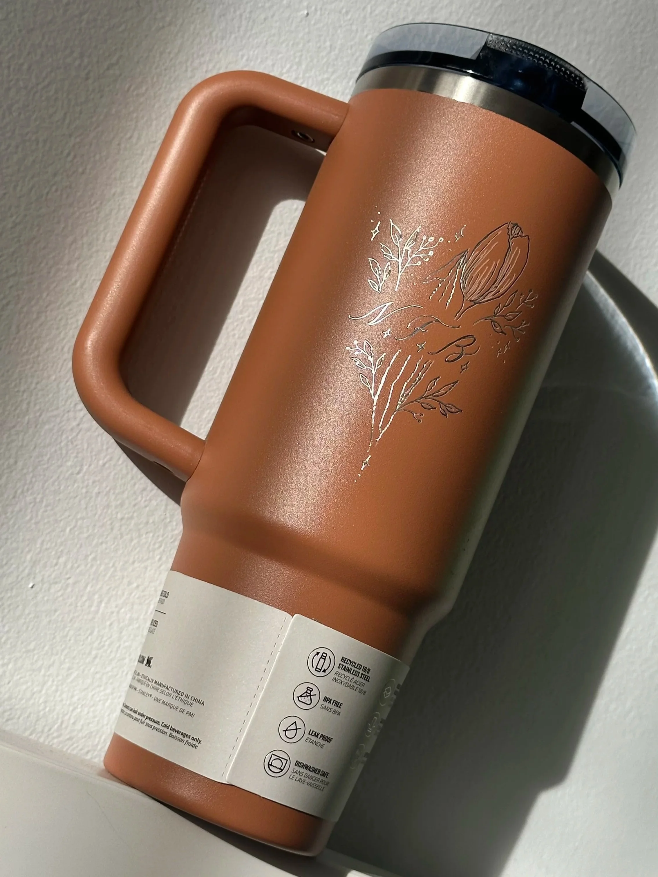 Personalized Stanley tumbler with hand engraving, featuring custom lettering on a reusable drink bottle - Didi Letters