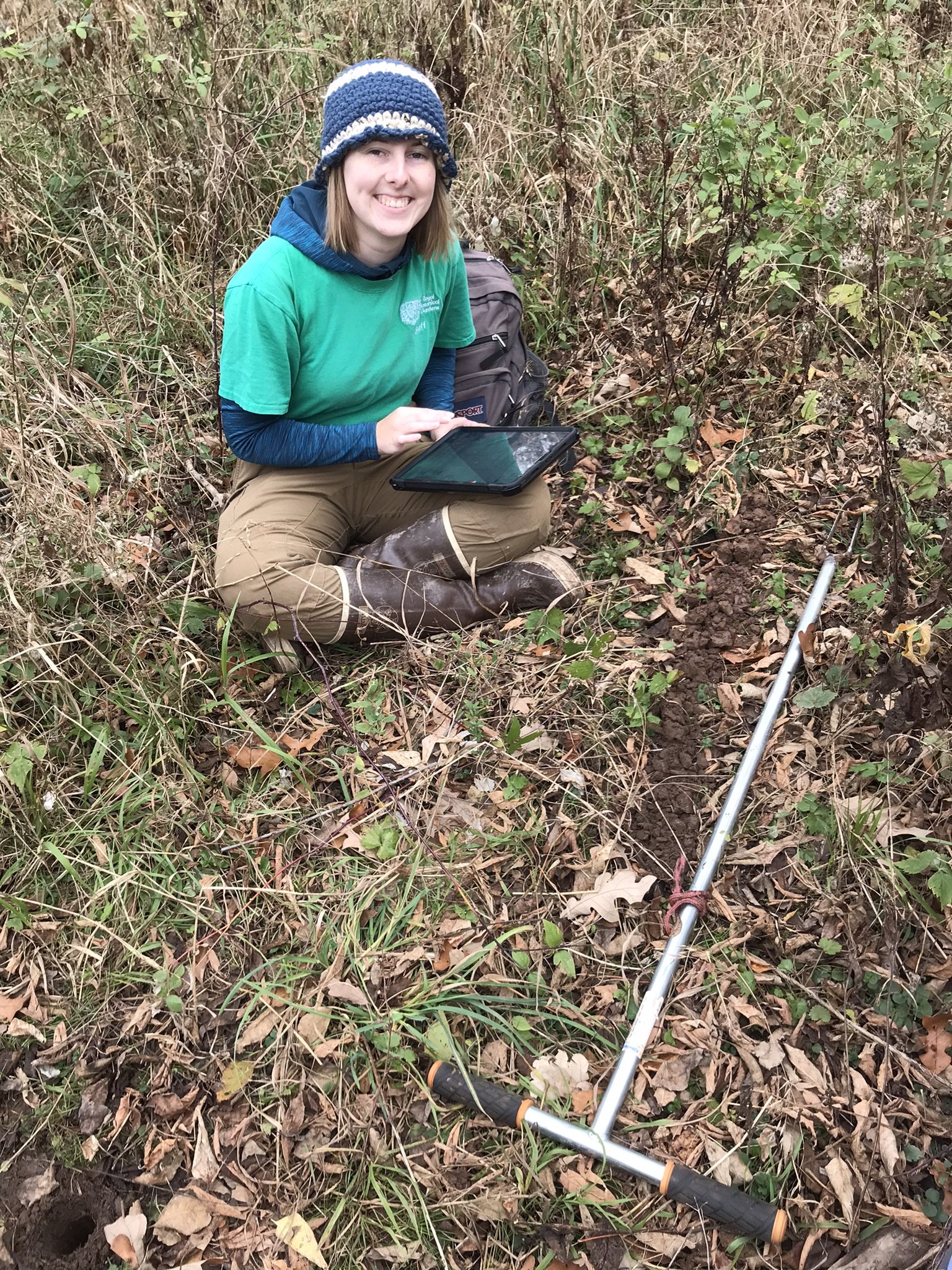  Botany Intern Megan Roulston inputting data for a soil survey in a floodplain (Photo by Kasia Zgurzynski).  