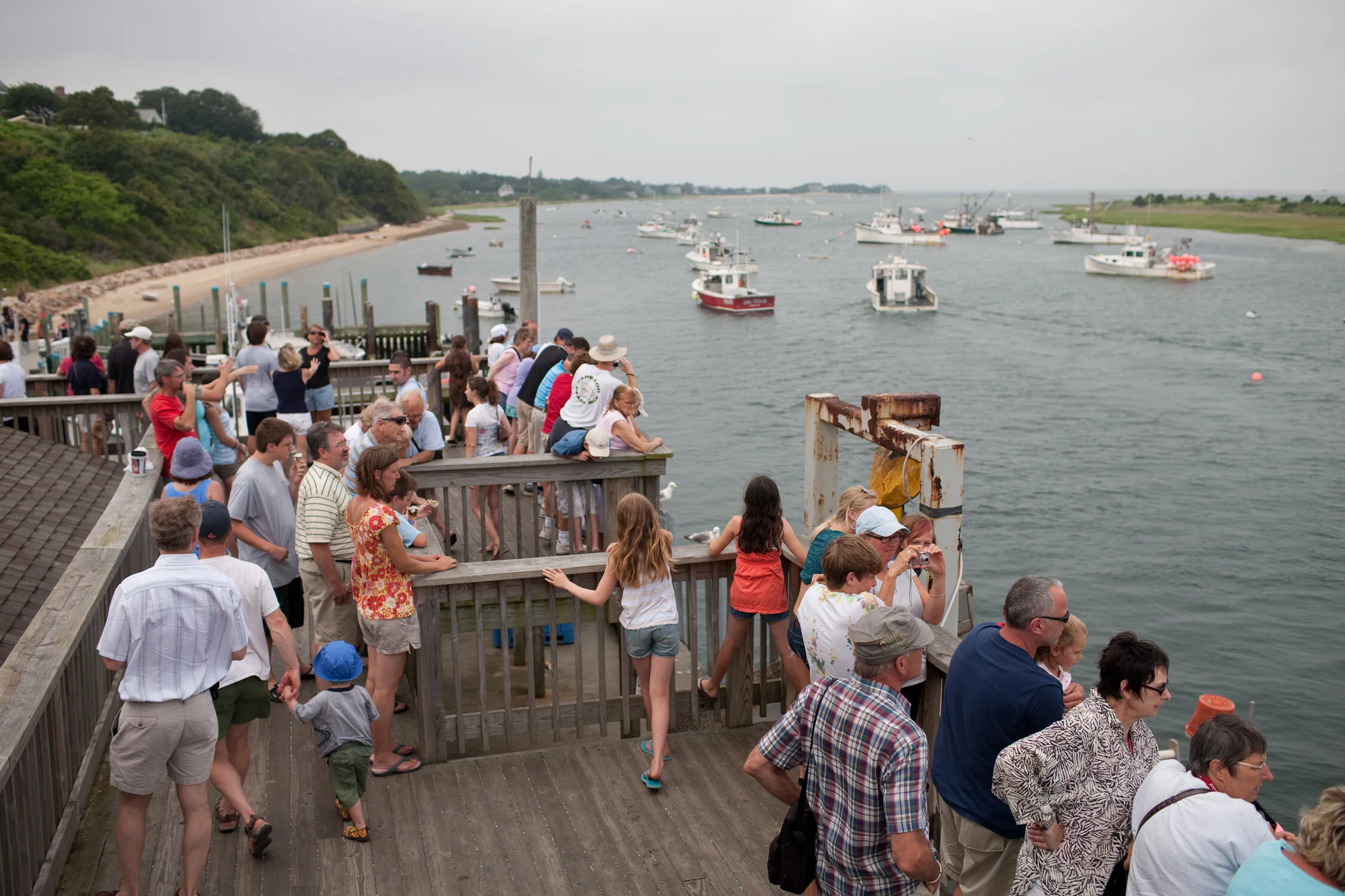 Visitors to Chatham enjoying the view from the Chatham Fish Pier observation deck.