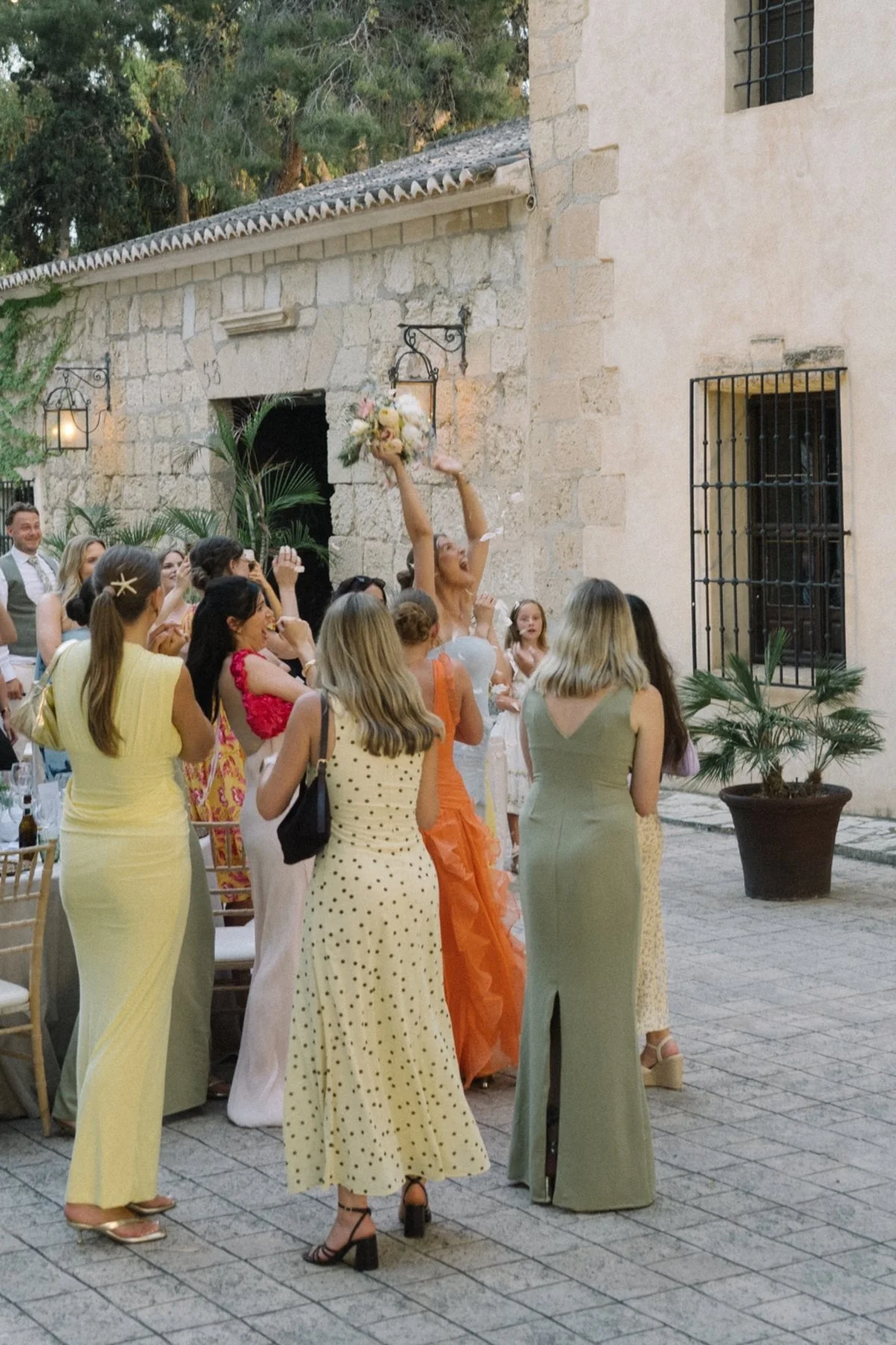 The wedding bouquet being caught