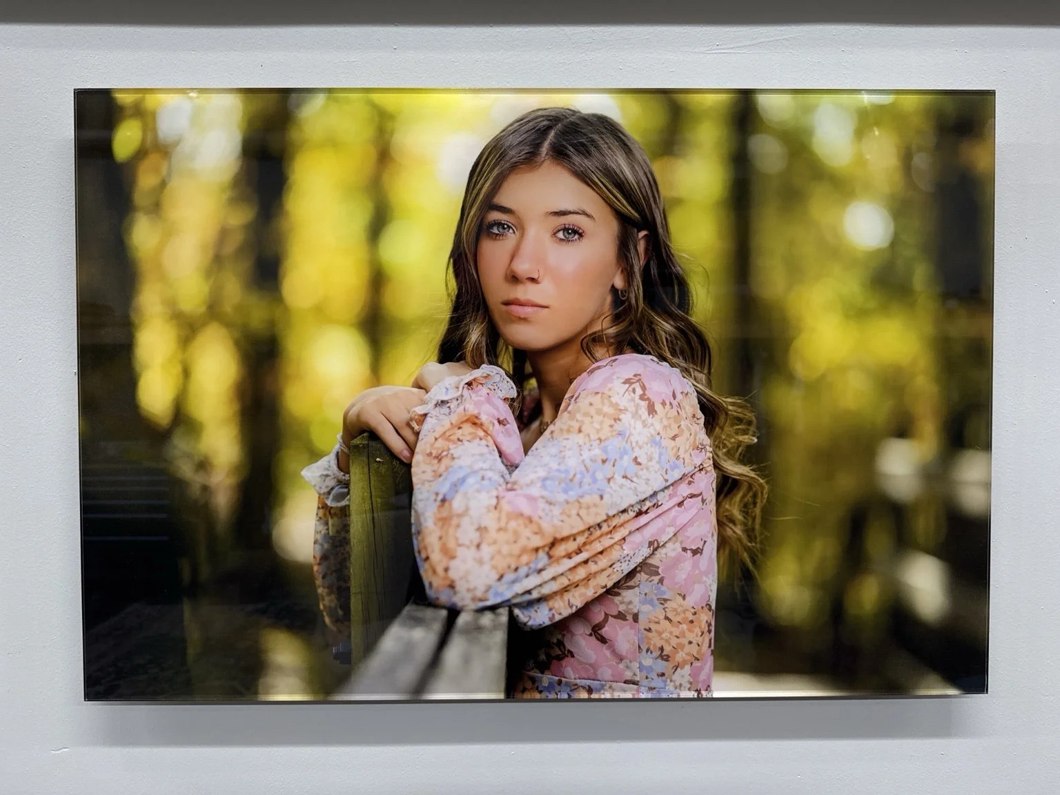 Finished acrylic senior portrait wall art displayed at Legacy Luxe Studio