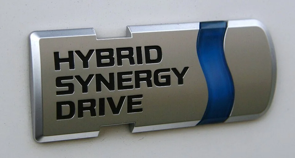 Automobile logo reading “Hybrid Synergy Drive”