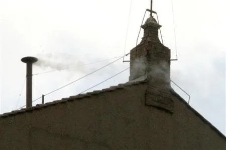 Photo of white smoke emanating from a chimney