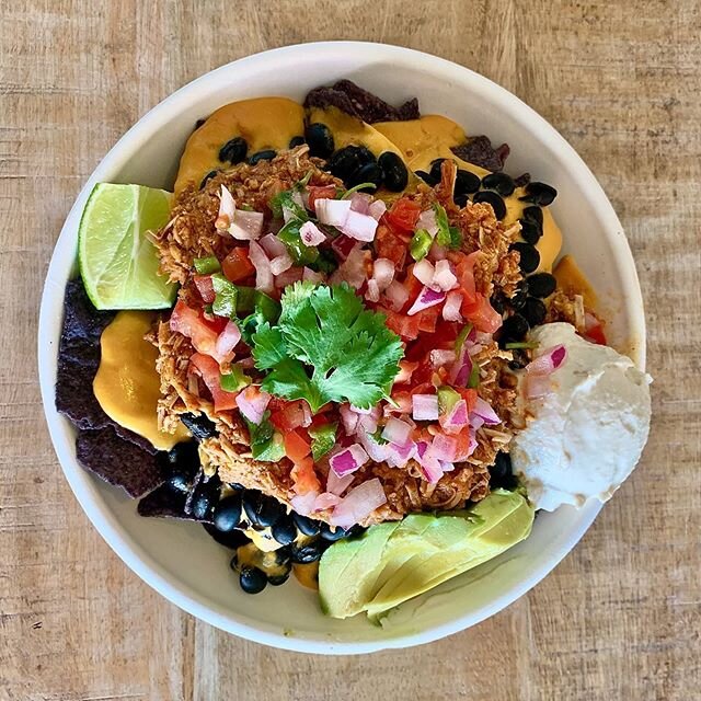 Superfood Nachos! This is a fan favorite. We have blue organic tortilla chips, black beans, jackfruit carnitas, avocado, pico de  Gallo, &ldquo;sour cream&rdquo;, and vegan cheese sauce. Everything is vegan and made in house!