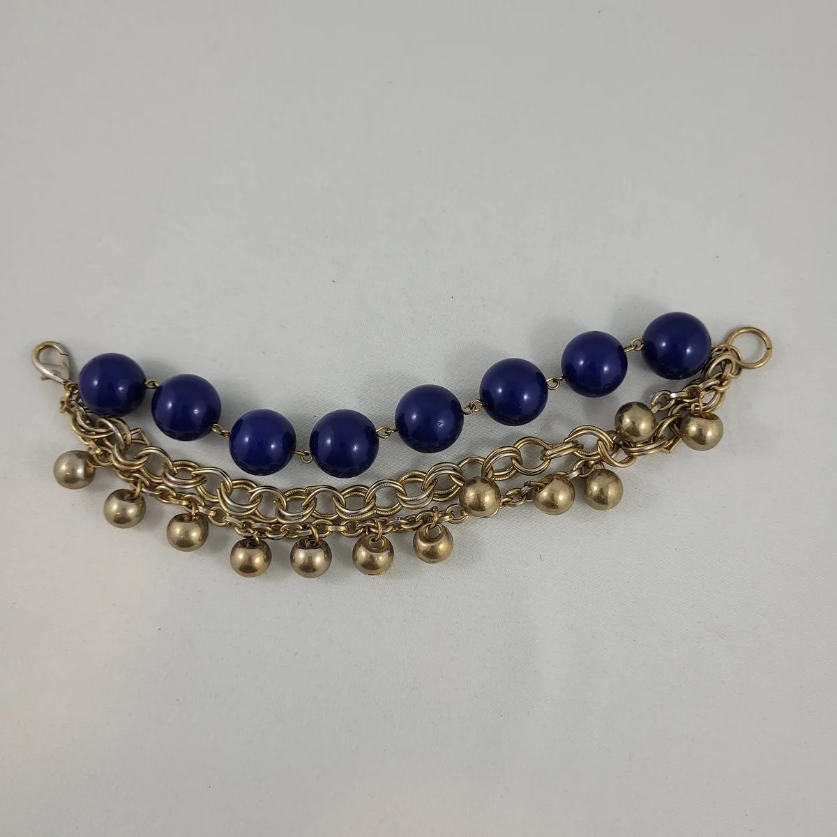 Triple Strand Washed Gold-tone Chain Navy Blue Round 16mm Bead Dangle Faux Bell 8 Inch Cha Cha Bracelet Front View