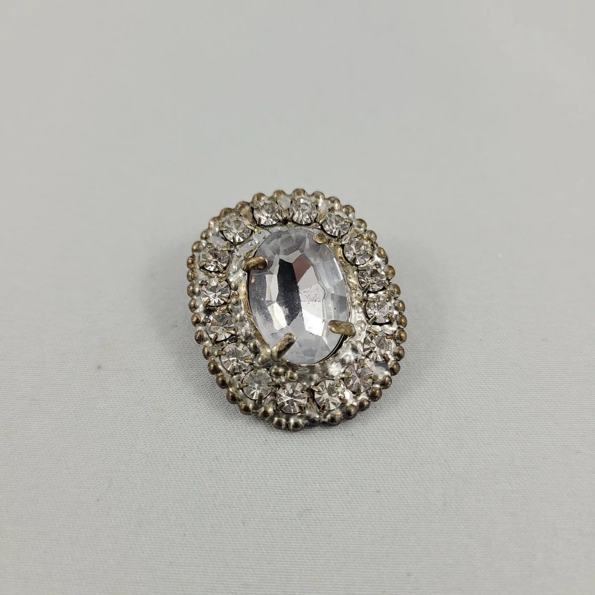 1930's Pot Metal Prong Set Clear Cabochon Chaton Pave Rhinestone 1.25 Inch Oval Brooch