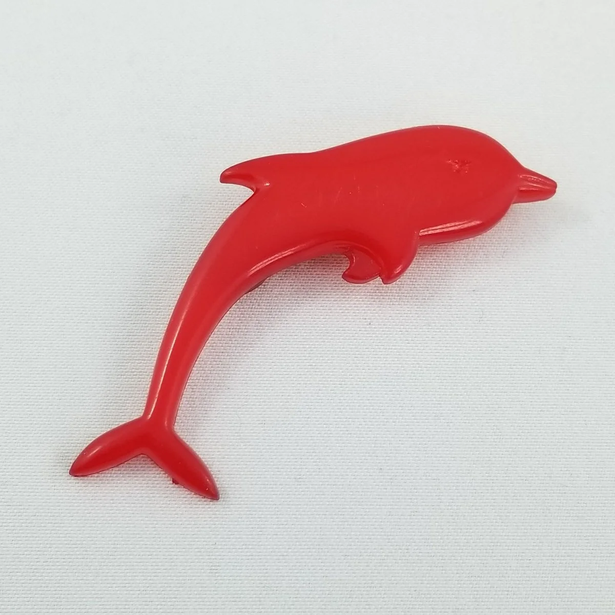 Buch and Deichmann Denmark Cherry Red Nylon Plastic Dolphin Brooch