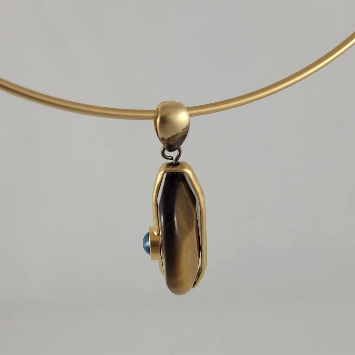 Arts and Crafts Style Matte Gold Wire Torque Collar Necklace Tigers Eye Slide Pendant with Blue Cabochon