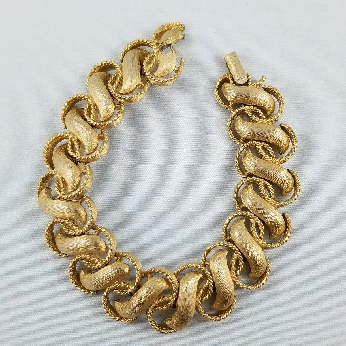 Trifari Crown Trifanium Articulated Gilded Scroll Wide Panel Bracelet.jpg
