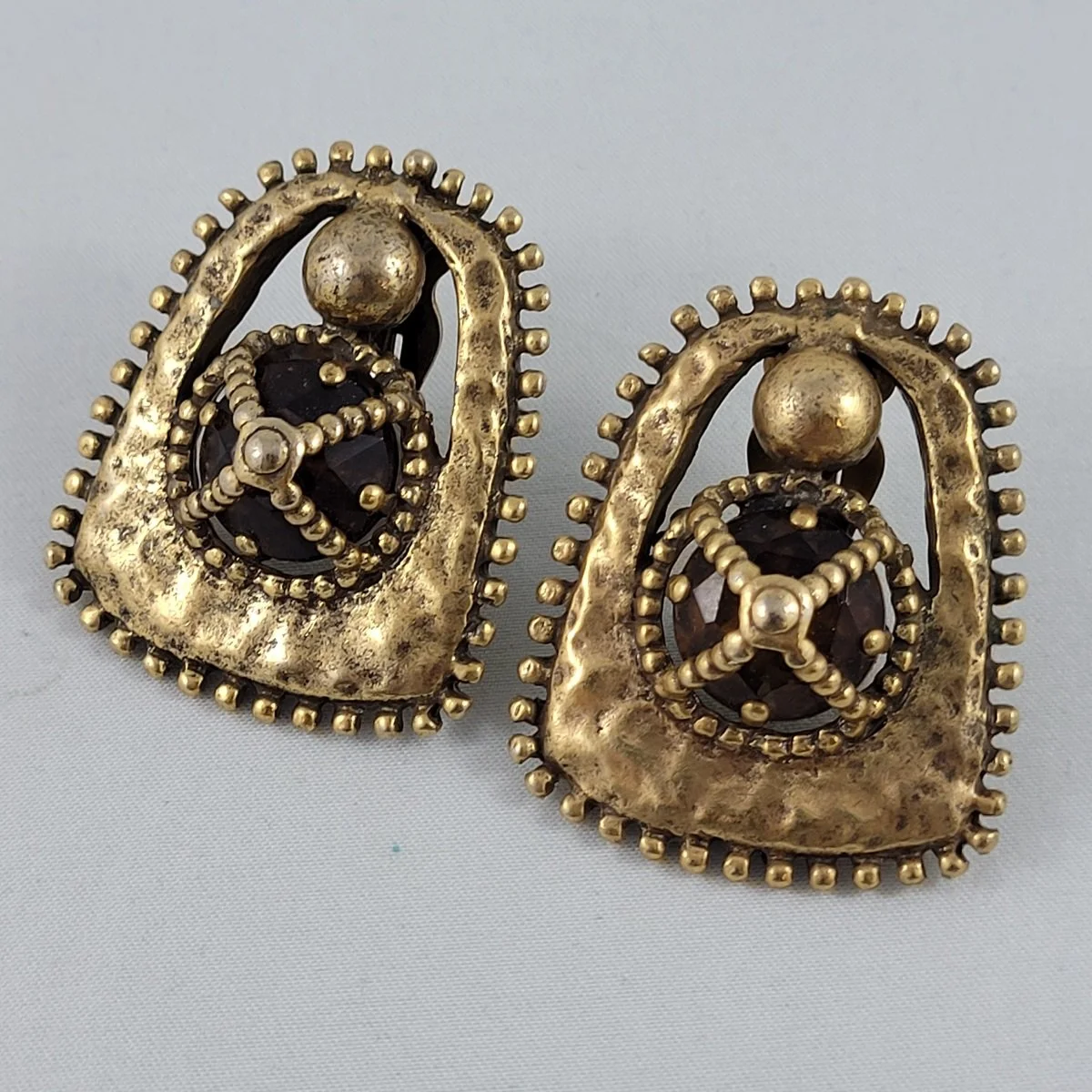 Etruscan Revival Brutalist Style Caged Brown Topaz Glass Gemstone Antiqued Gold Hammered Clip-on Earrings Front View