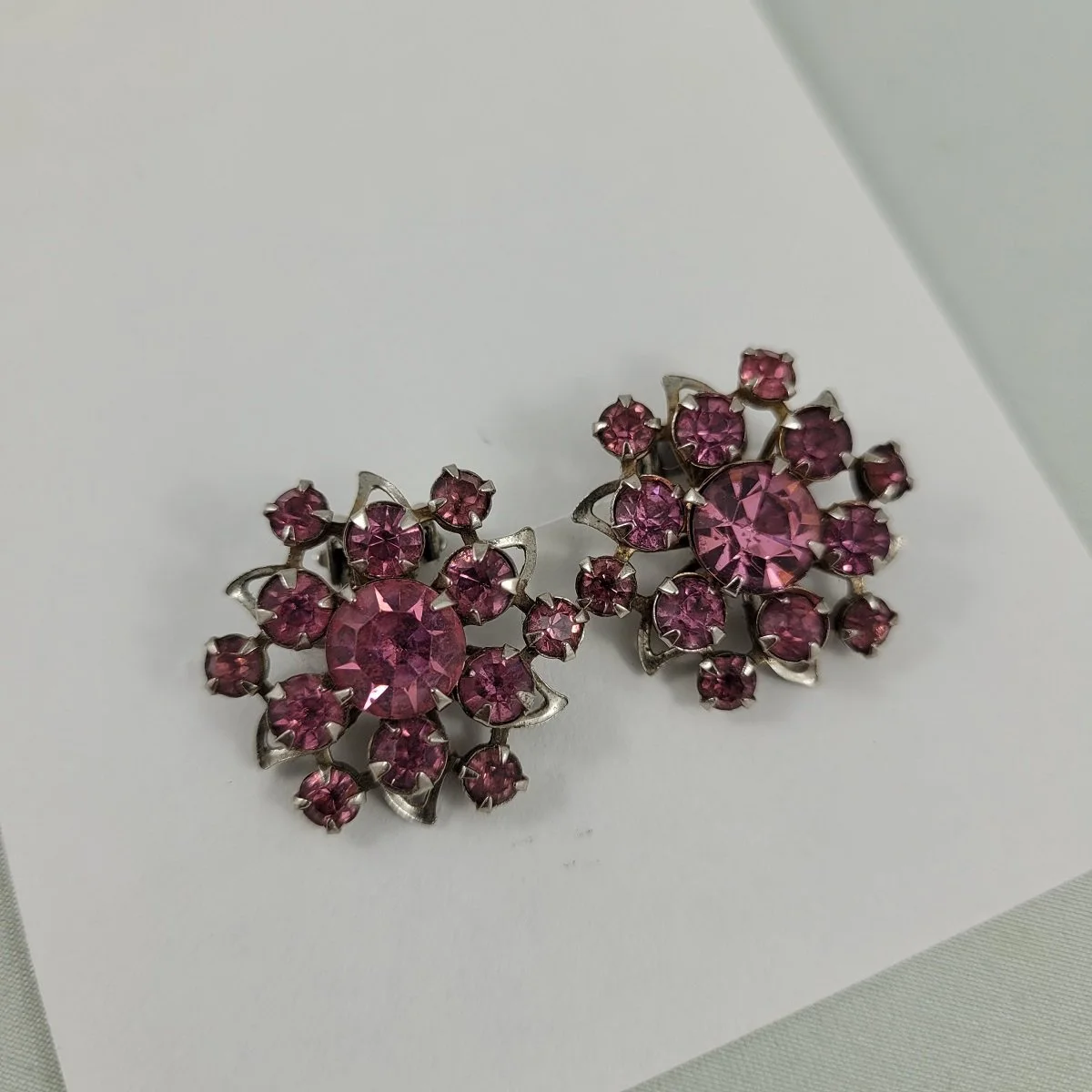 1950's - 1960's Prong Set Faceted Pink Rhinestone Rivet Open Back Silver-tone Filigree Flower Clip-on 1 Inch Earrings Close Up