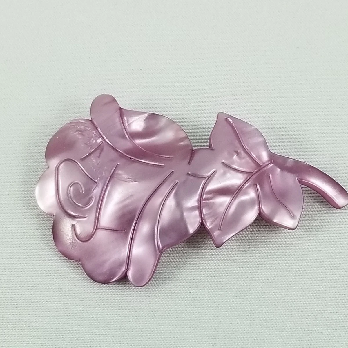 Lea Stein Attributed Purple Silk Rhodoid Incised Domed Rose Brooch.jpg