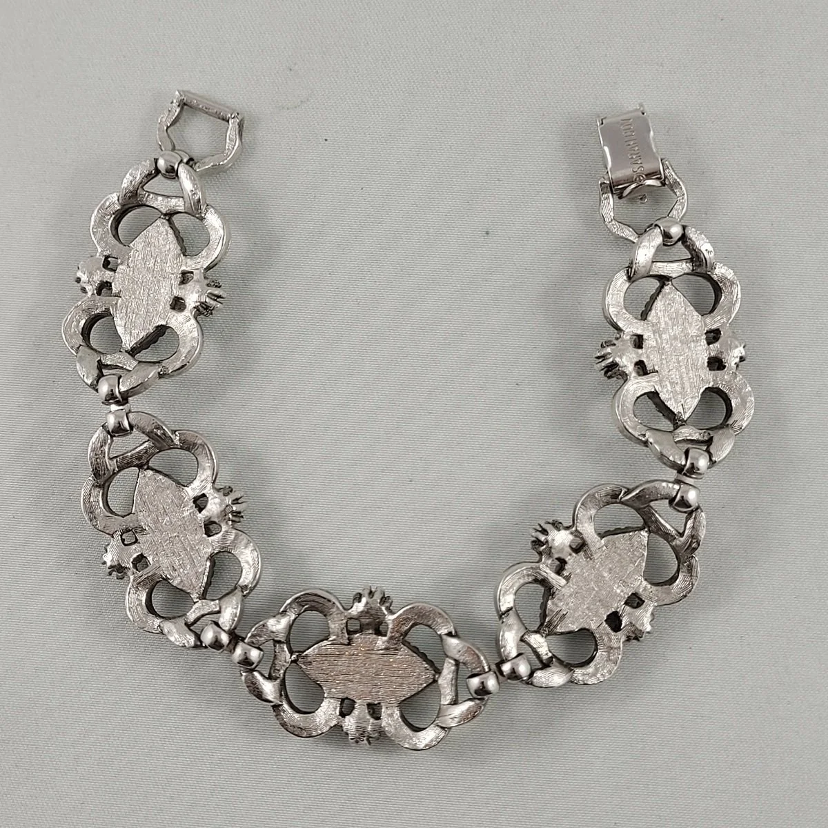 Sarah Coventry Confetti Lucite Injected Resin Turquoise Cabochon Pearl Brushed Silver Early Panel Link Bracelet -2.jpg (Copy)