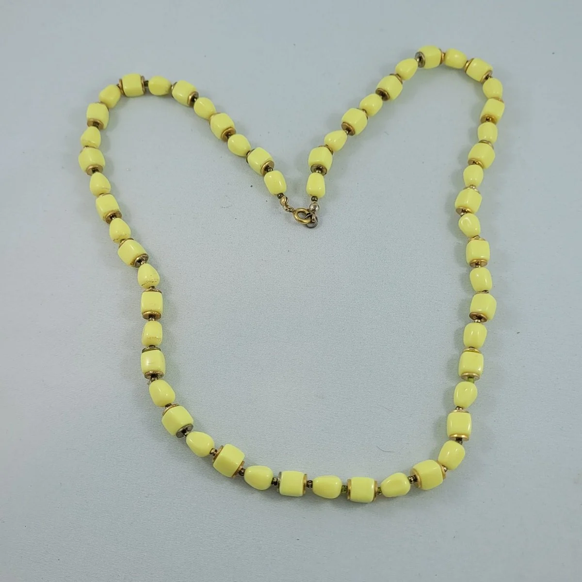 1960's Milky Yellow Lucite Alternating Pillow Cube Tapered Barrel Bead 25 Inch Matinee Necklace -2.jpg