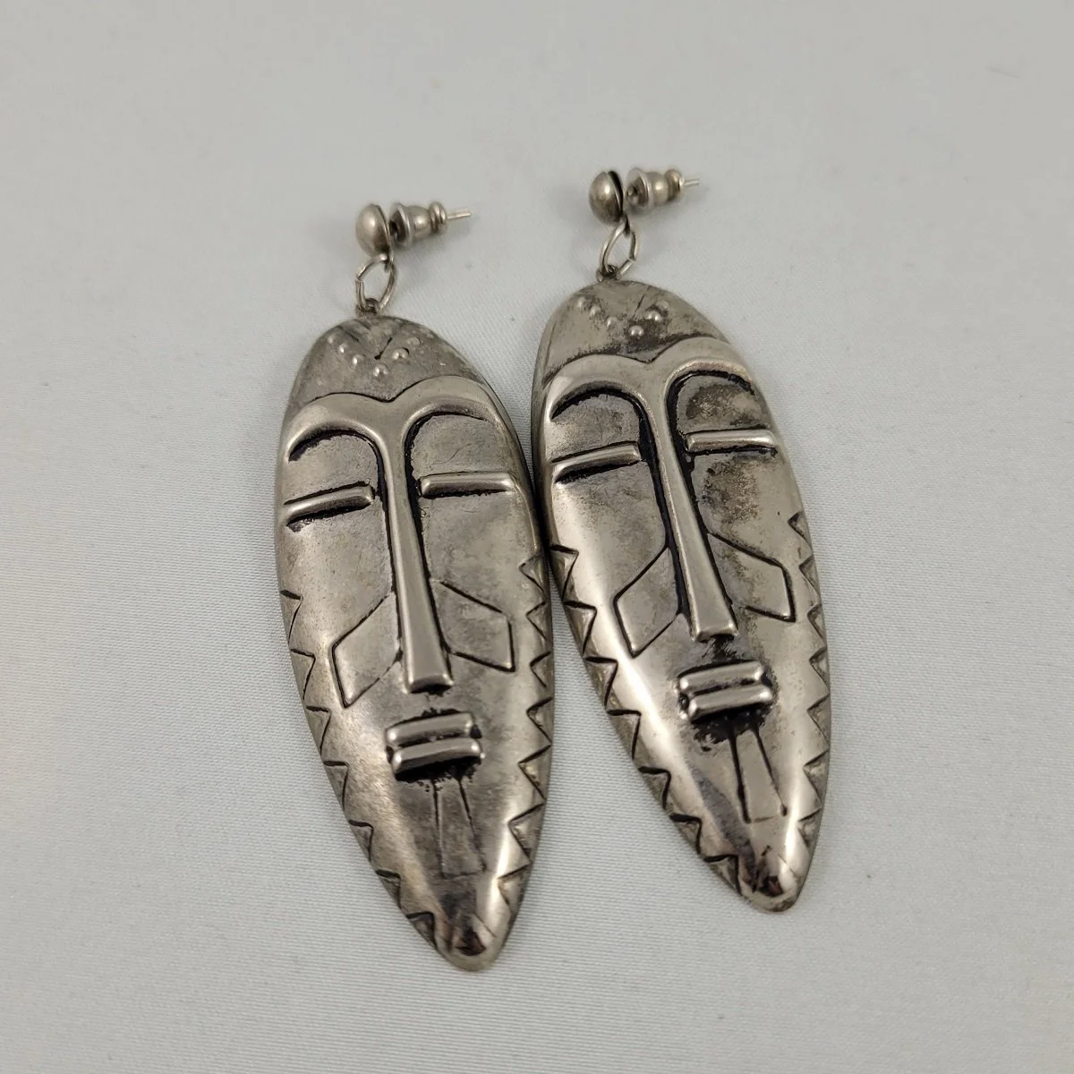 Rustic Silver-tone Repousse Elongated Tribal Mask Drop Pierced Earrings.jpg